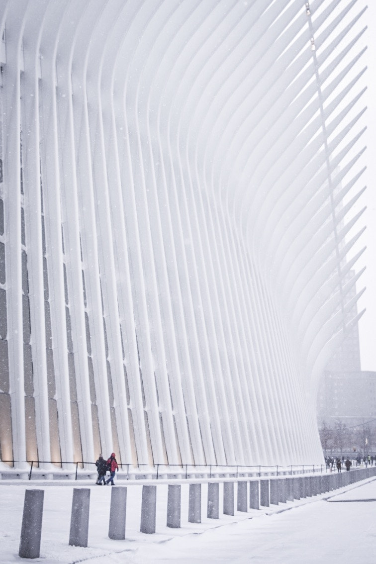 Nikon D3300 sample photo. People trudging by calatrava's oculus in the snow photography