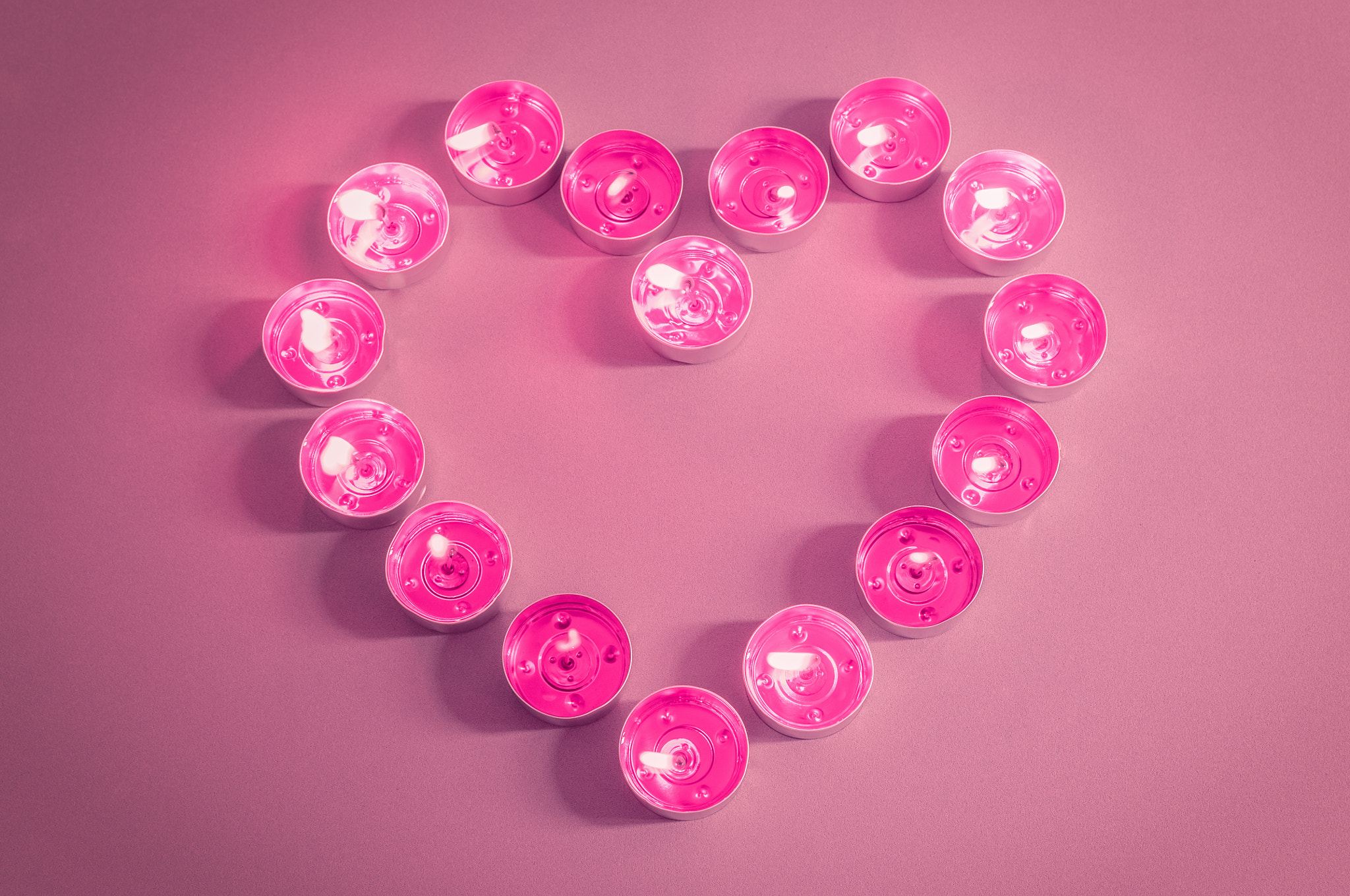 Nikon D300 sample photo. Heart shaped flaming pink tealight candles photography