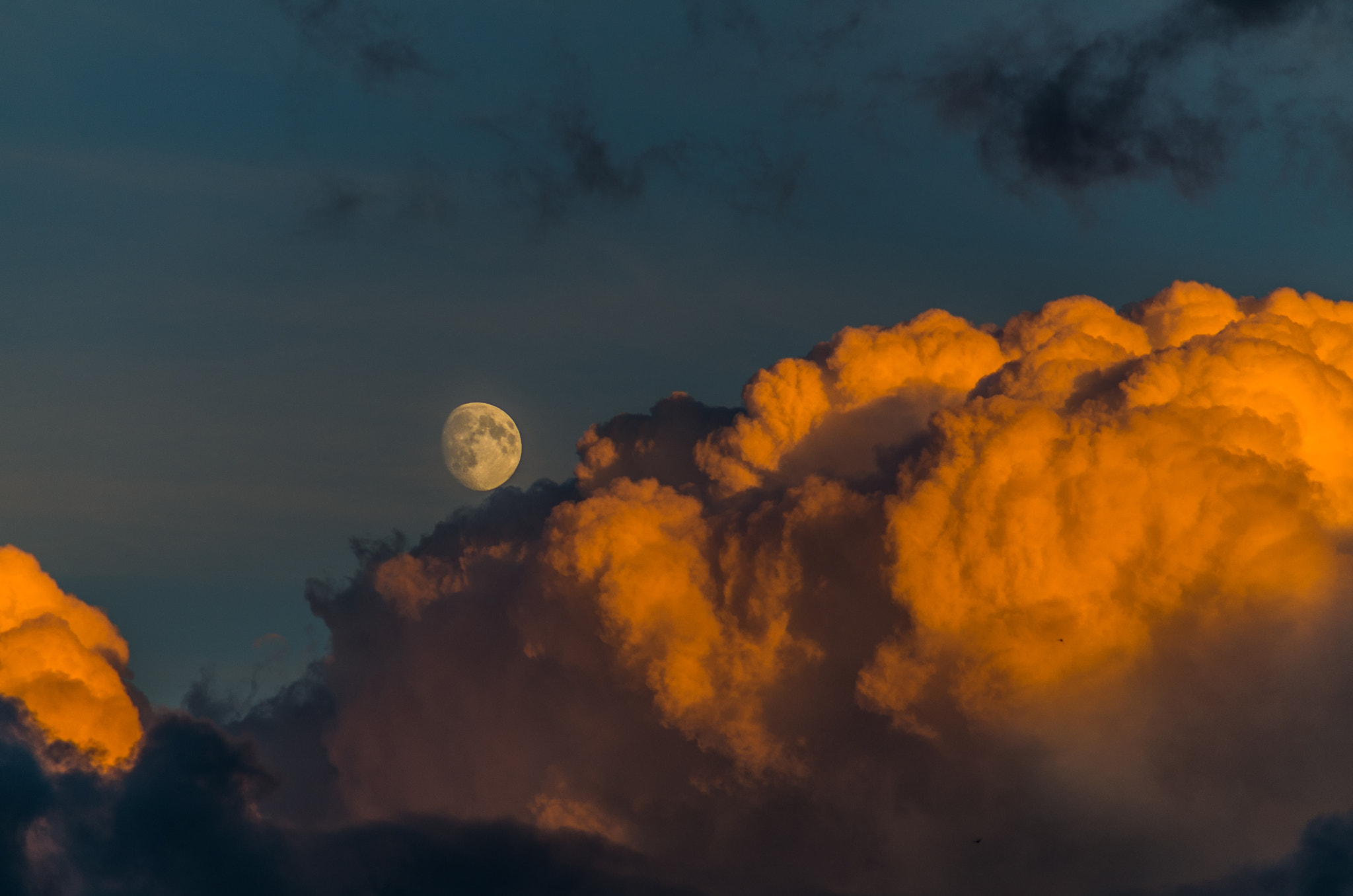 Pentax K-50 sample photo. Moon behind the clouds photography