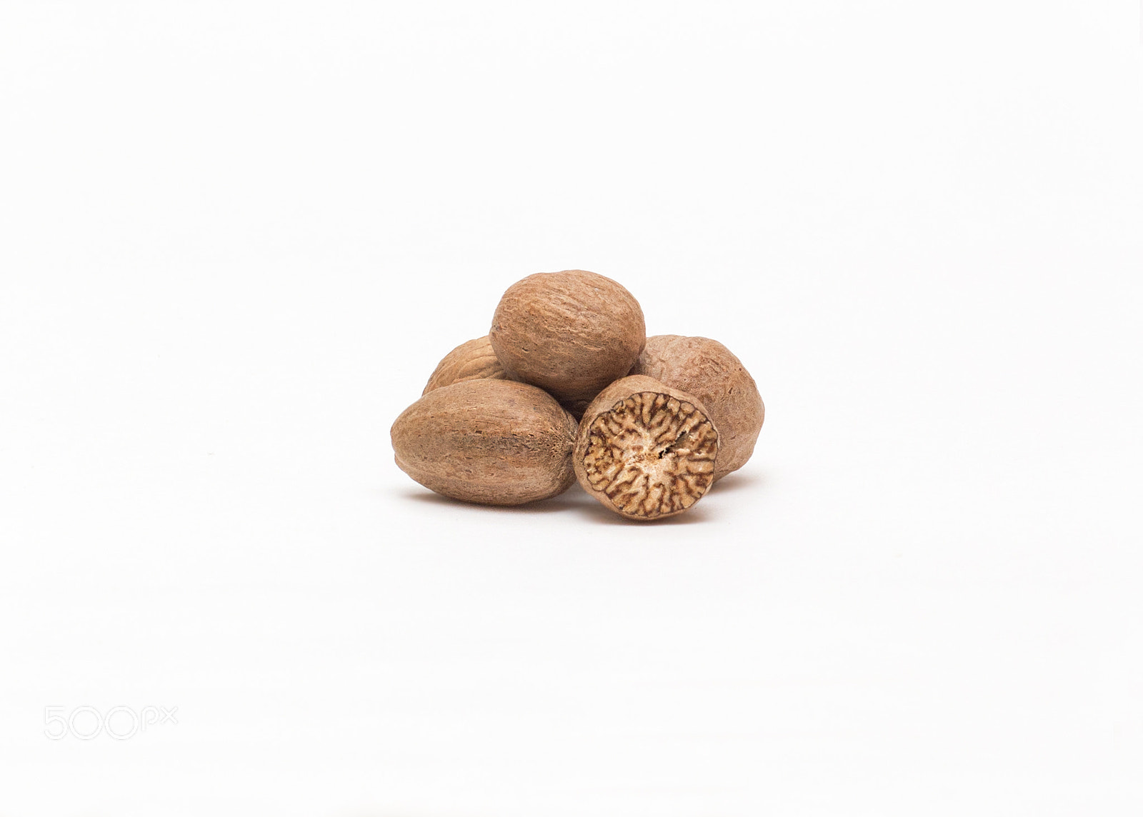 Nikon D7100 sample photo. Nutmeg isolated on white background with shadow photography