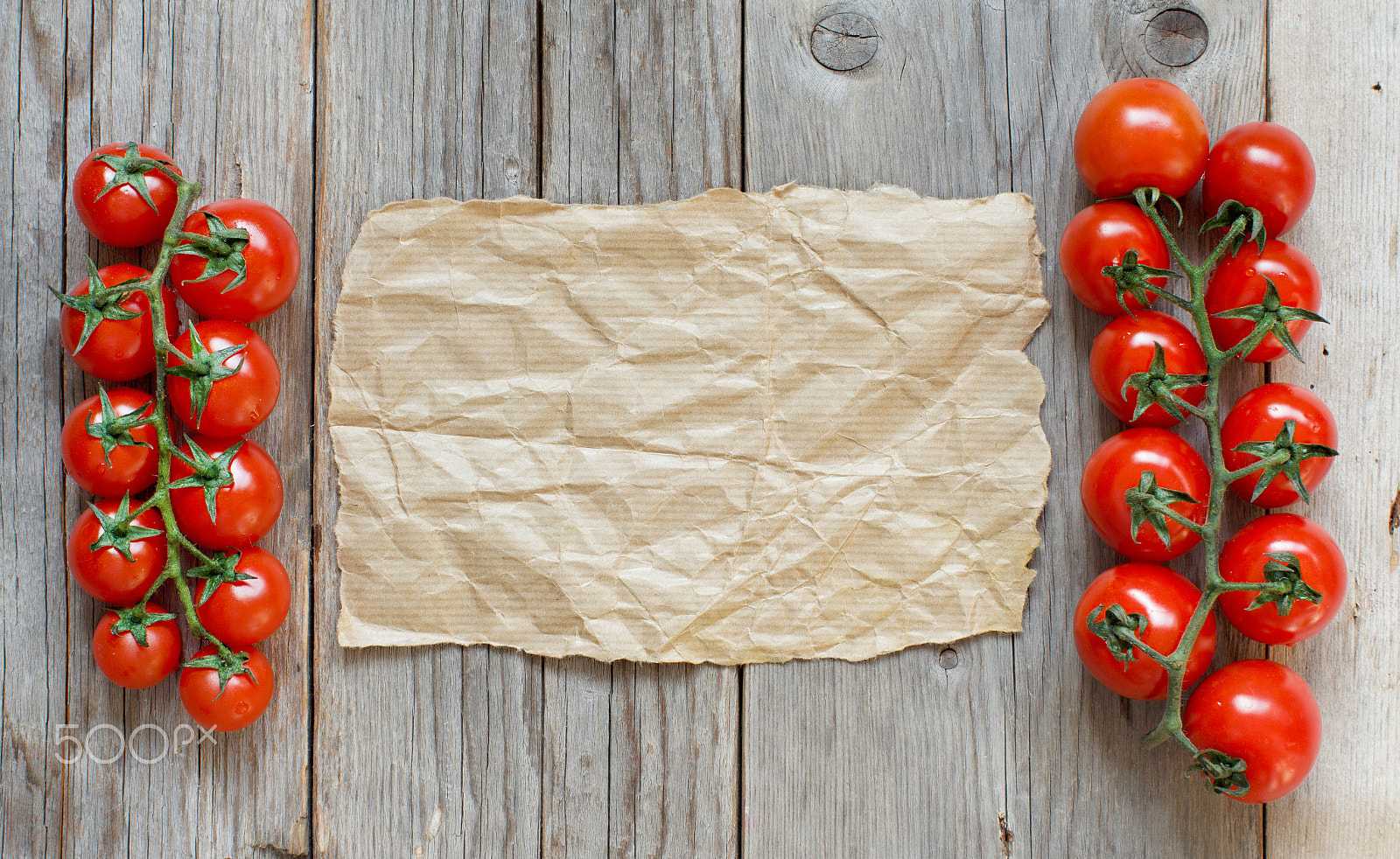 Canon EOS 650D (EOS Rebel T4i / EOS Kiss X6i) + Canon EF 50mm F1.2L USM sample photo. Cherry tomatoes with craft paper photography