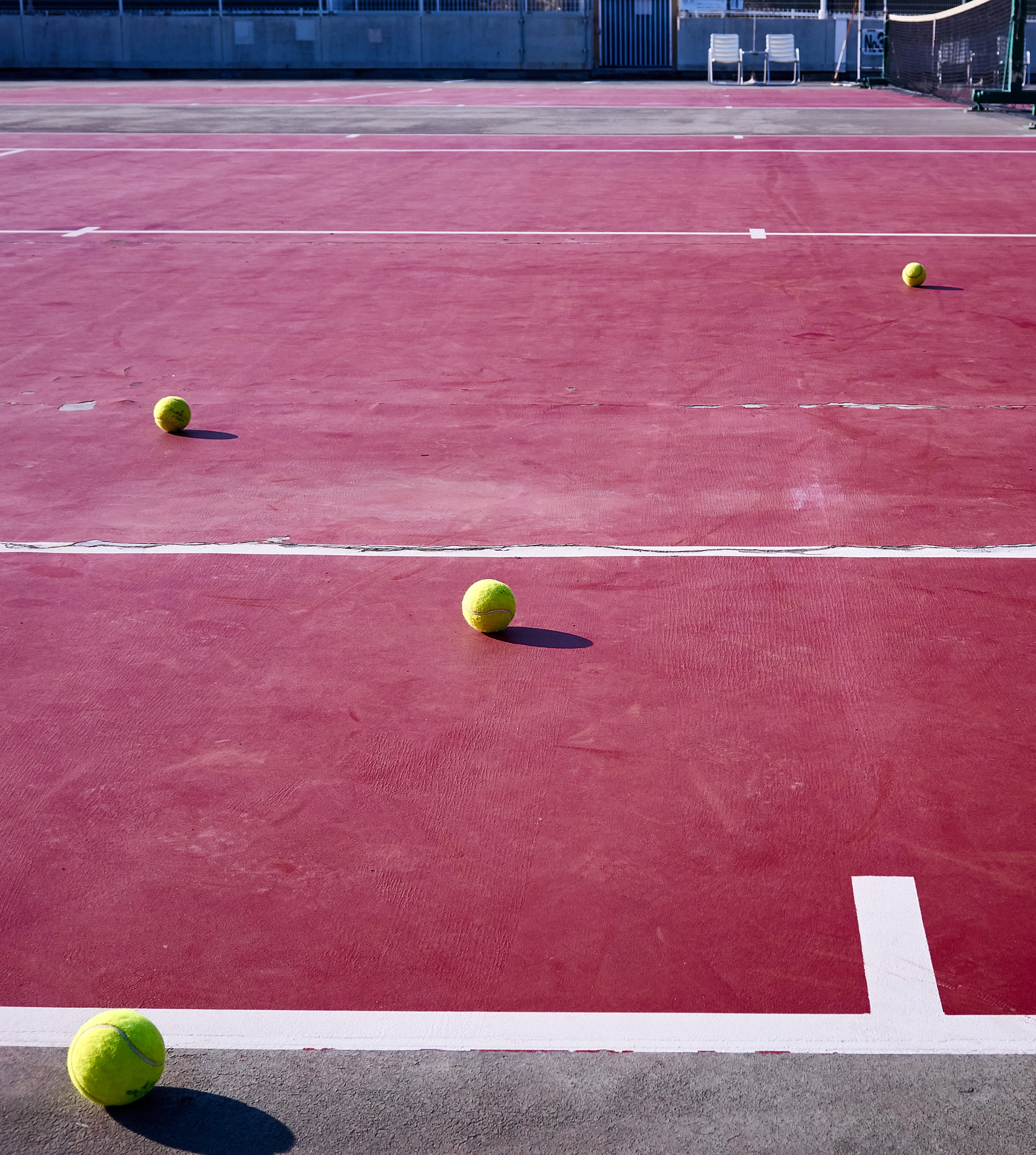 Sony Cyber-shot DSC-RX10 sample photo. Tennis court with balls photography
