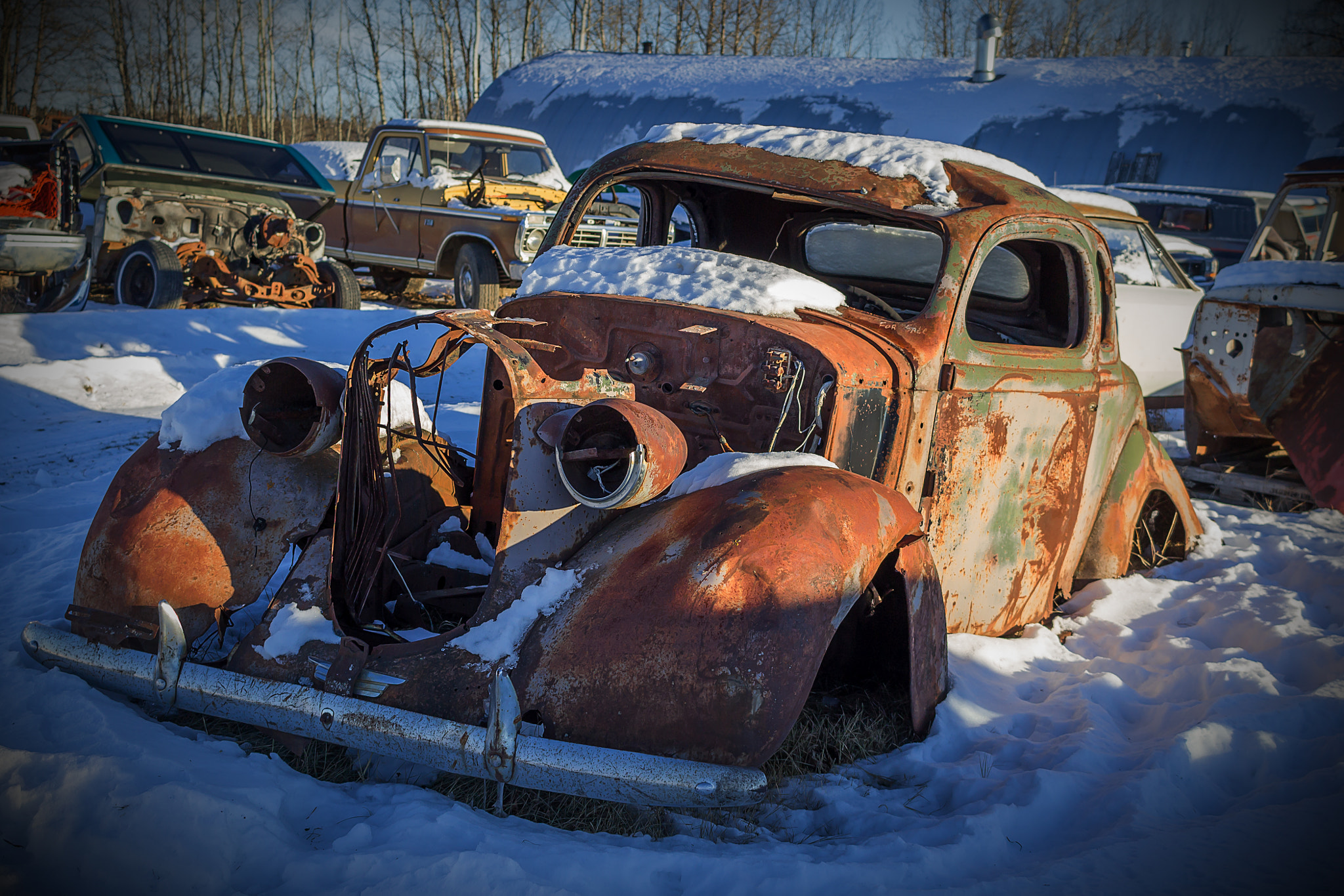 Canon EF-S 24mm F2.8 STM sample photo. Old cars in winter snow and ice photography
