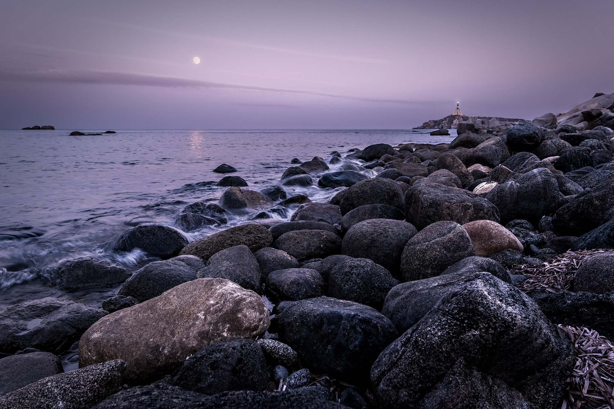 Canon EOS M sample photo. A lighthouse in the distance photography