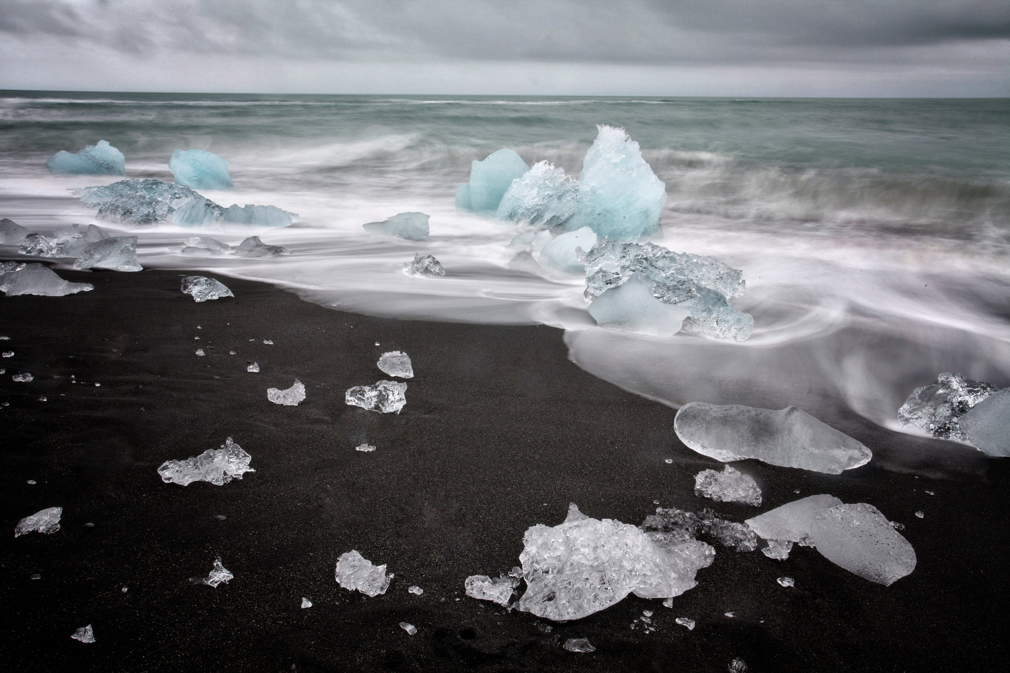 Canon EOS 5D Mark II sample photo. Ice littering the iceland black beach like diamonds castaway from a stormy sea. photography