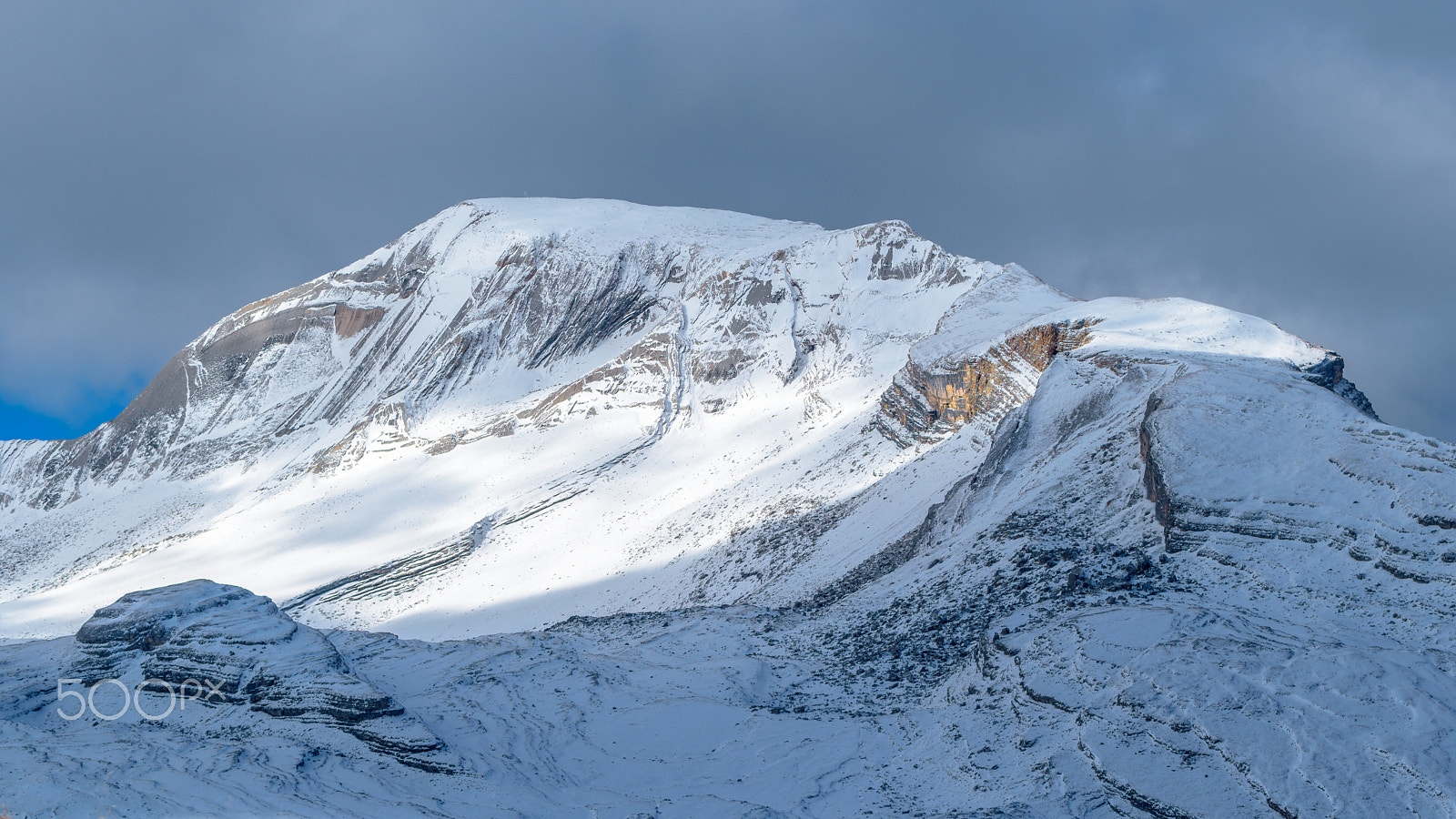 Nikon AF-S Nikkor 70-200mm F4G ED VR sample photo. Rock and snow photography