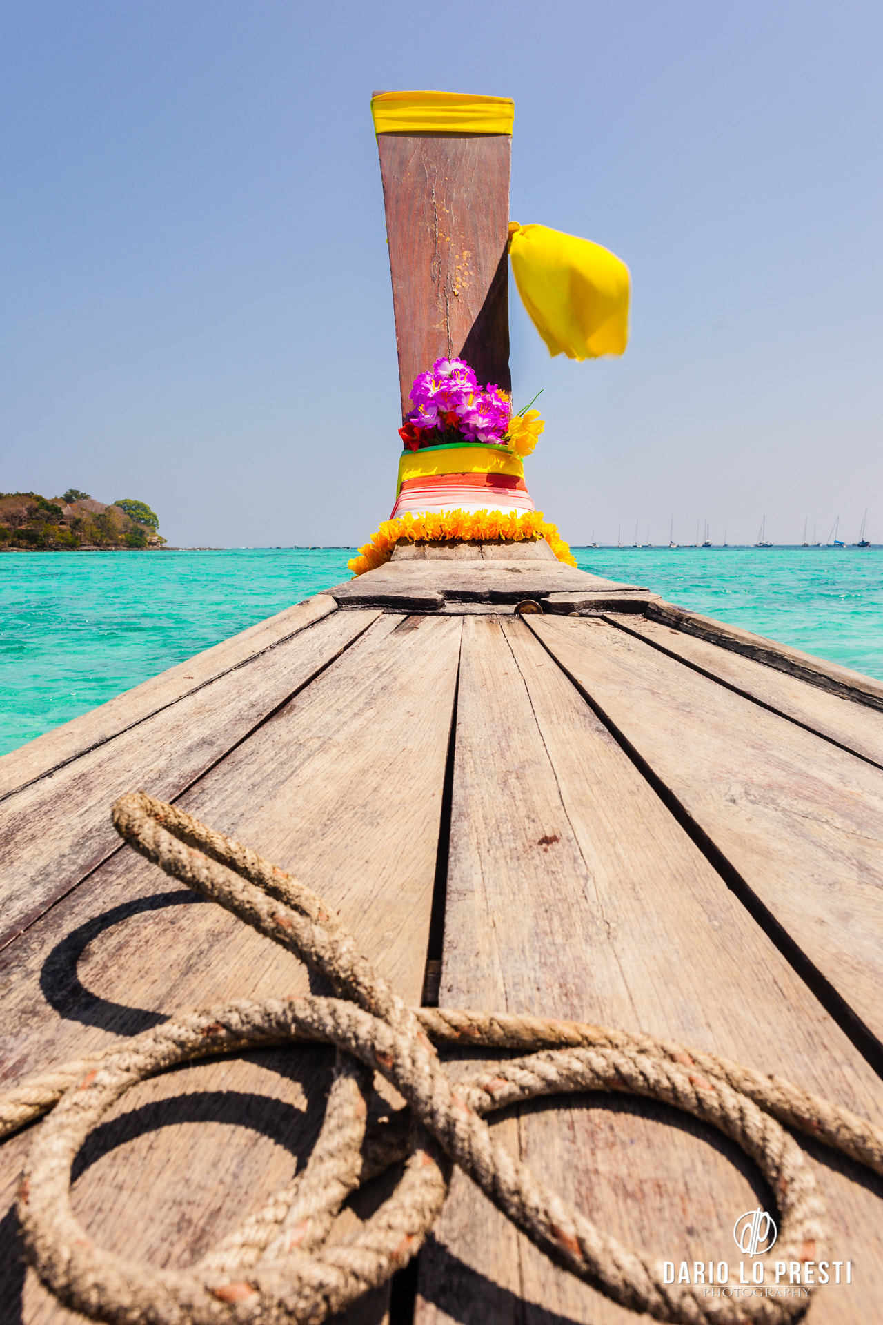 Canon EOS 5D Mark II sample photo. Long tail boat in a tropical sea photography