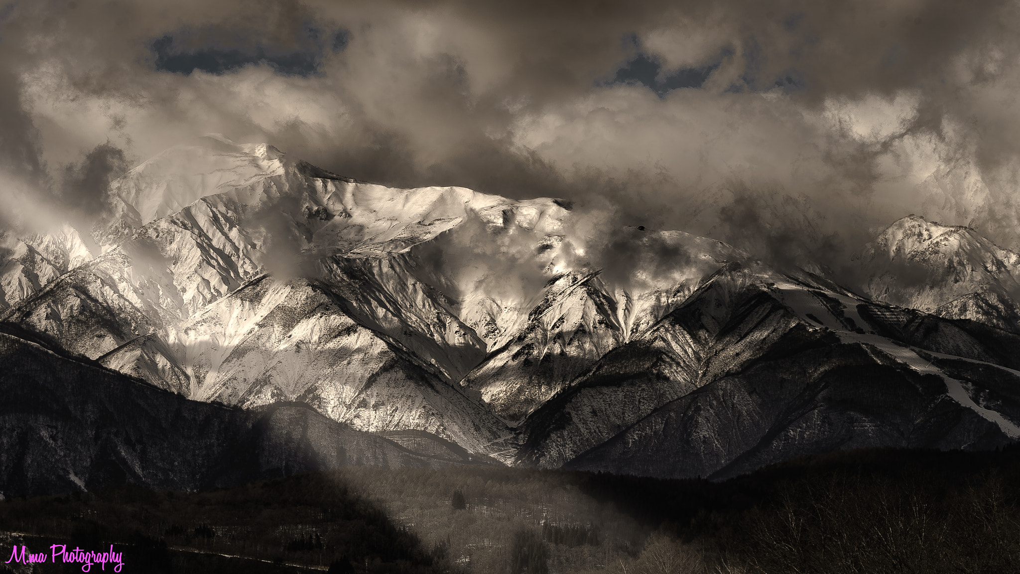 Sony FE 90mm F2.8 Macro G OSS sample photo. A mountain covered with clouds photography