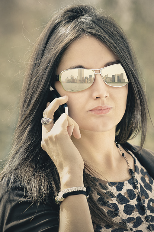Nikon AF-S Nikkor 70-200mm F4G ED VR sample photo. Woman talking on phone photography