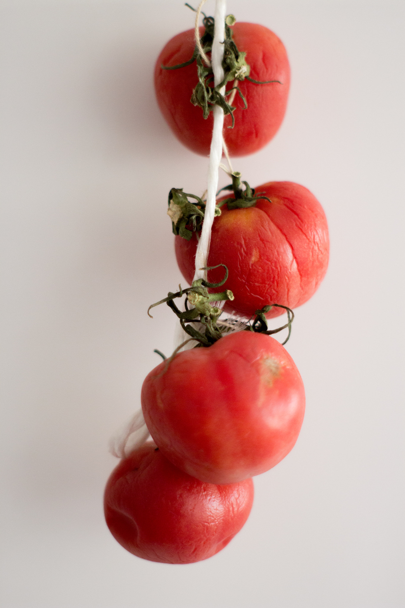 Canon EF 35-80mm f/4-5.6 sample photo. Old hanging tomatoes photography