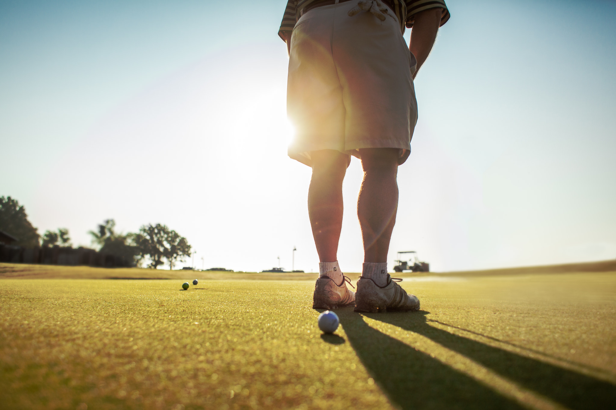 Canon EF 28mm F1.8 USM sample photo. Sunset putt at black bear country club photography