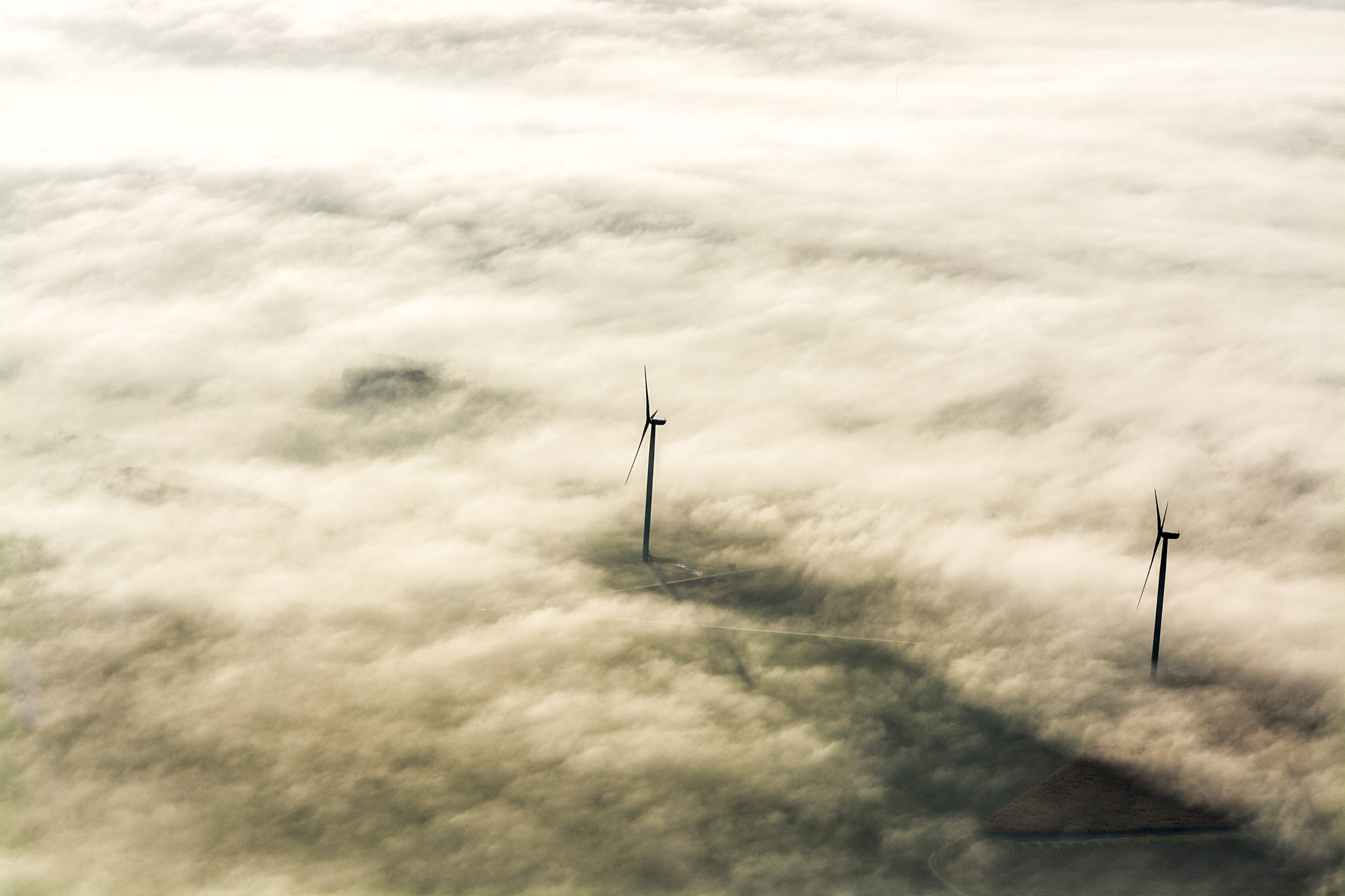 Sigma 70-200mm F2.8 EX DG Macro HSM II sample photo. Wind turbines in fog photography