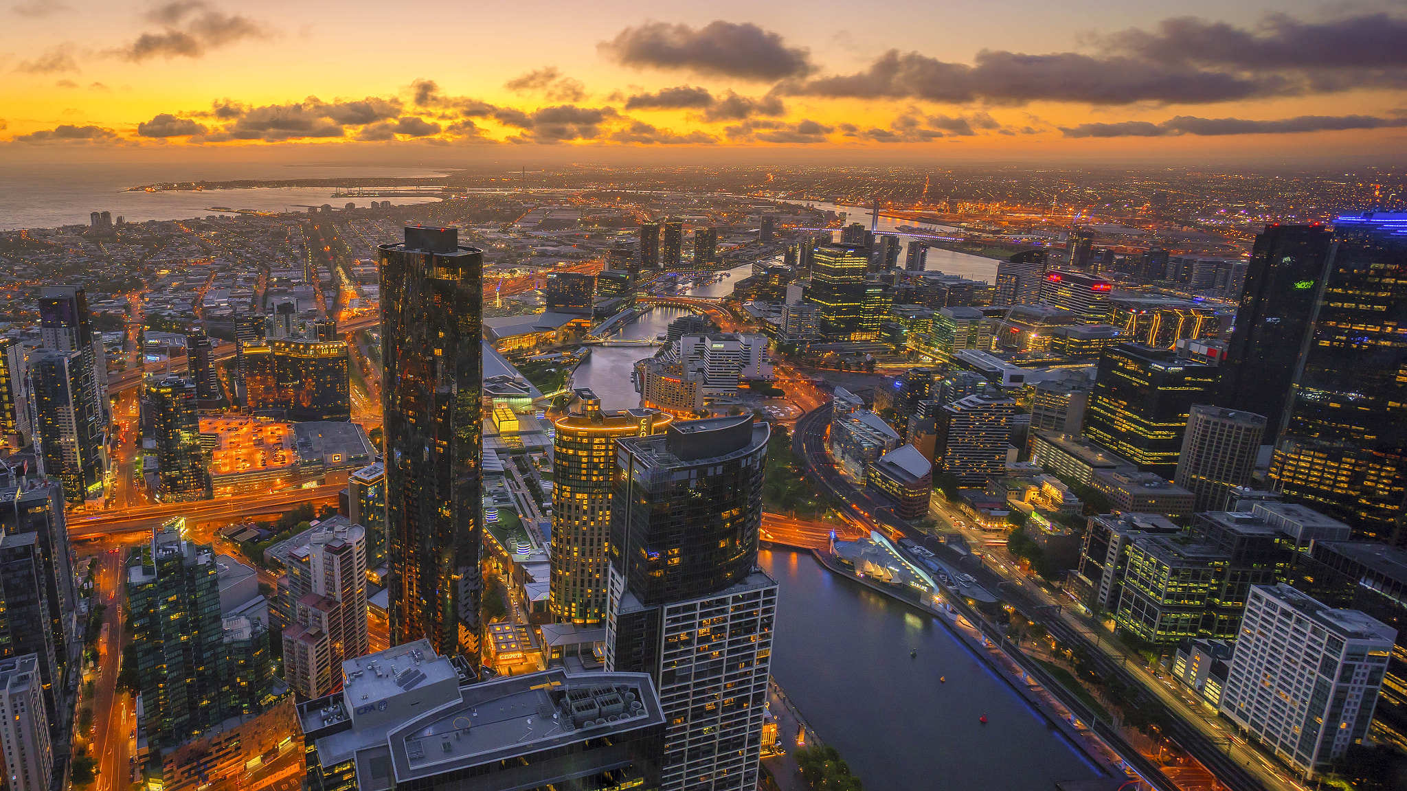 Sony a7R + Sony E 10-18mm F4 OSS sample photo. Aerial view of dramatic sunset at melbourne city skyline photography