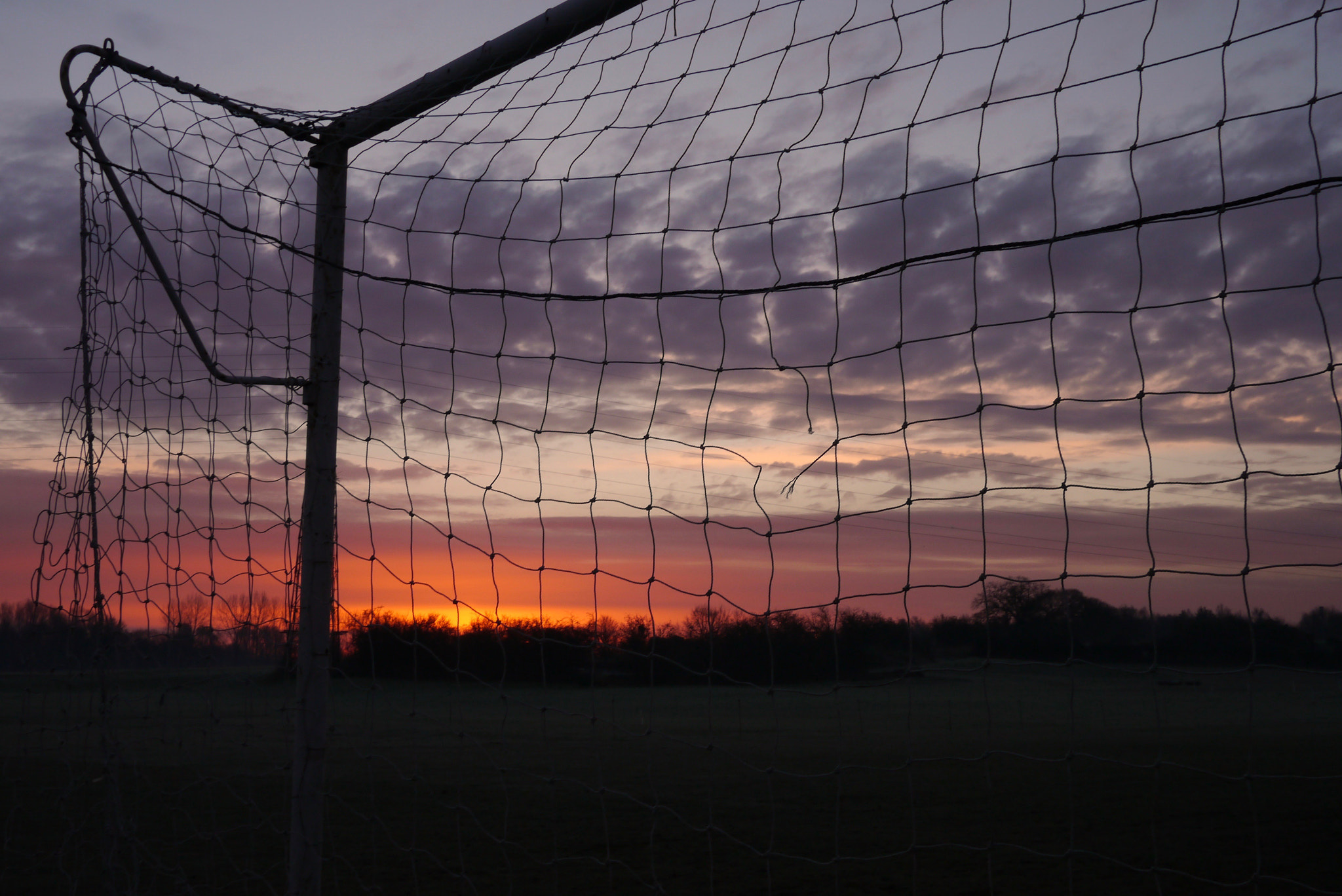 Panasonic Lumix DMC-GX1 + LUMIX G 20/F1.7 II sample photo. Sunrise behind the goal photography