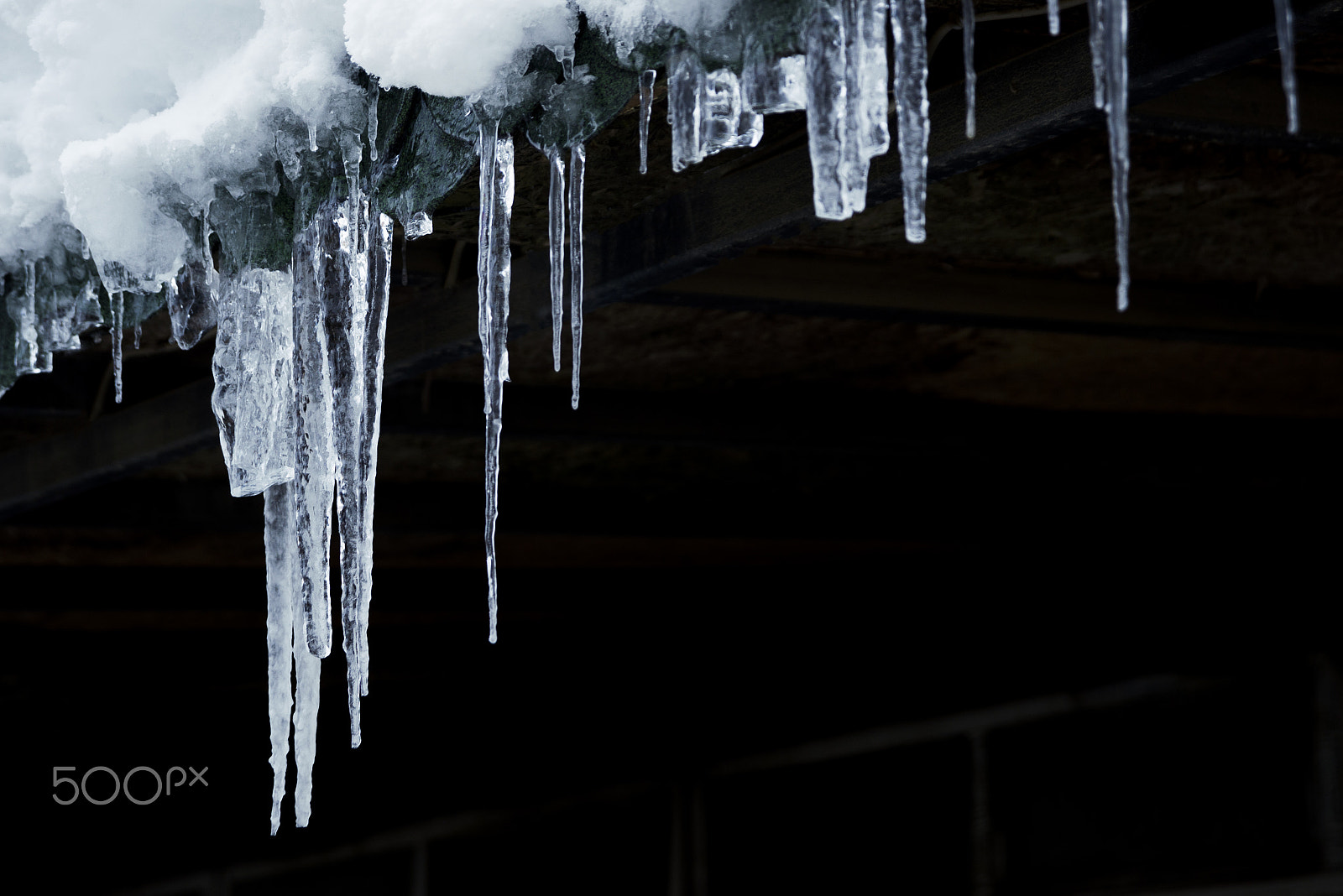 Nikon D610 sample photo. Ice stalactites on black background. photography