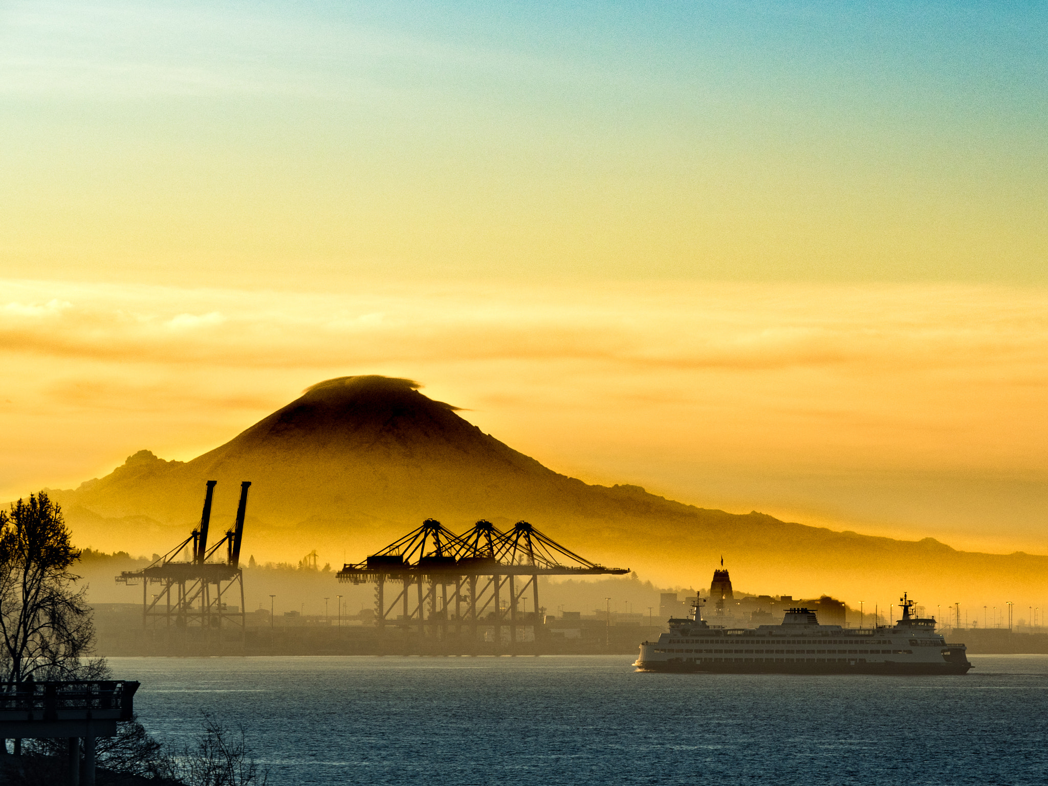Panasonic Lumix G X Vario 35-100mm F2.8 OIS sample photo. Mountain, fog, and ferry photography