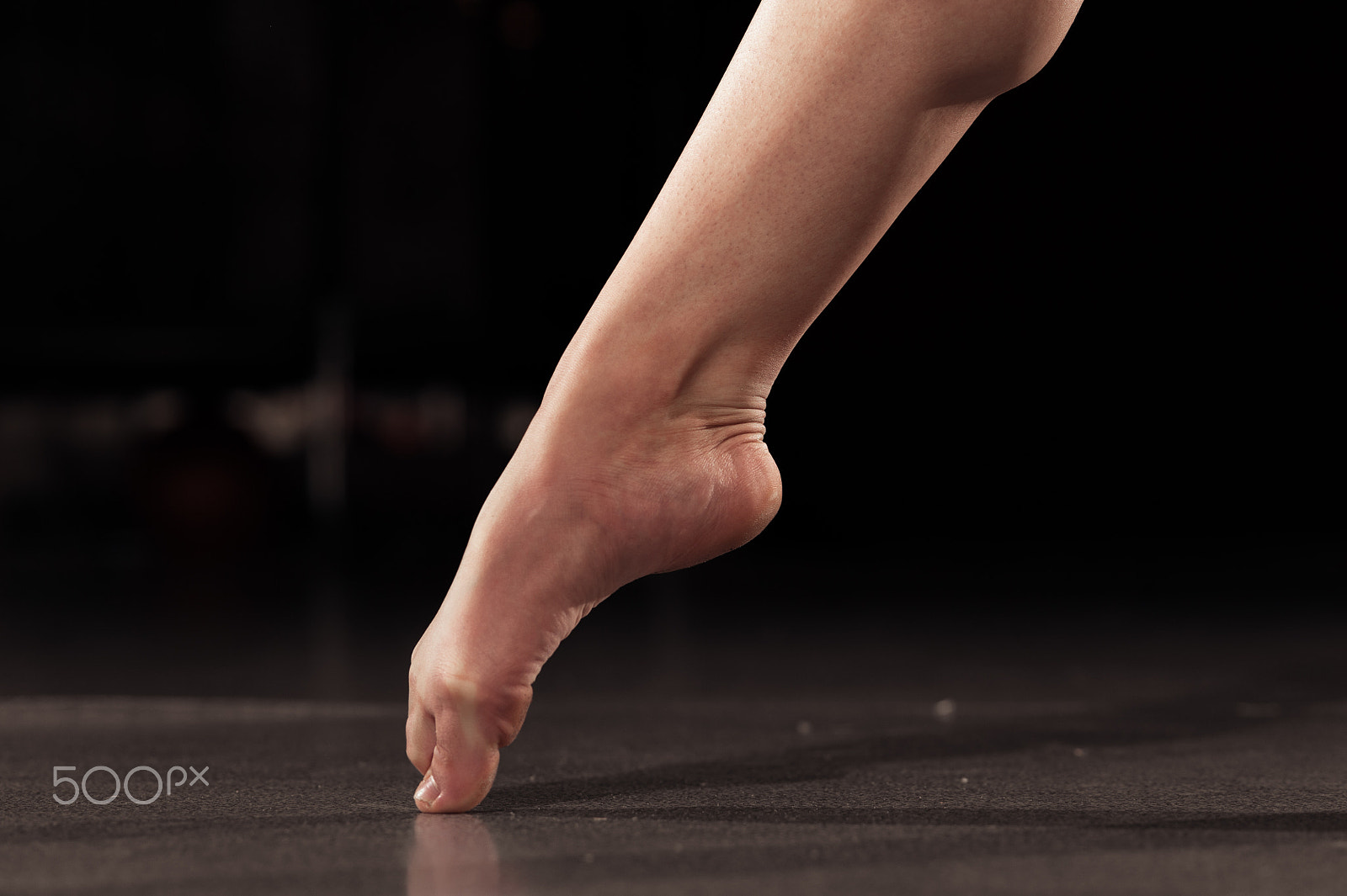 Nikon D700 + AF Micro-Nikkor 105mm f/2.8 sample photo. Female teen dancer warming up and stretching legs photography