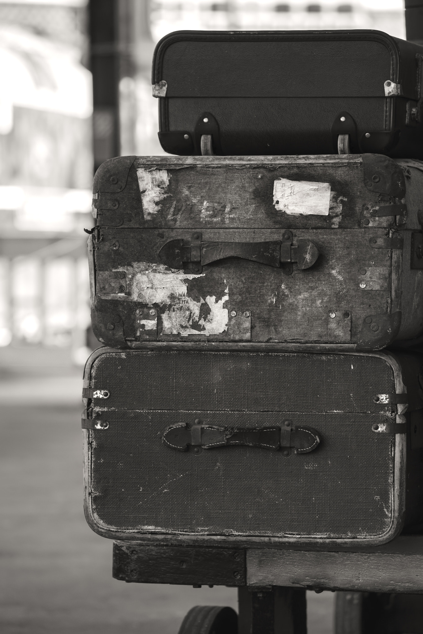 Nikon D800 sample photo. Old worn vintage suitcases stacked on train railway platform in photography