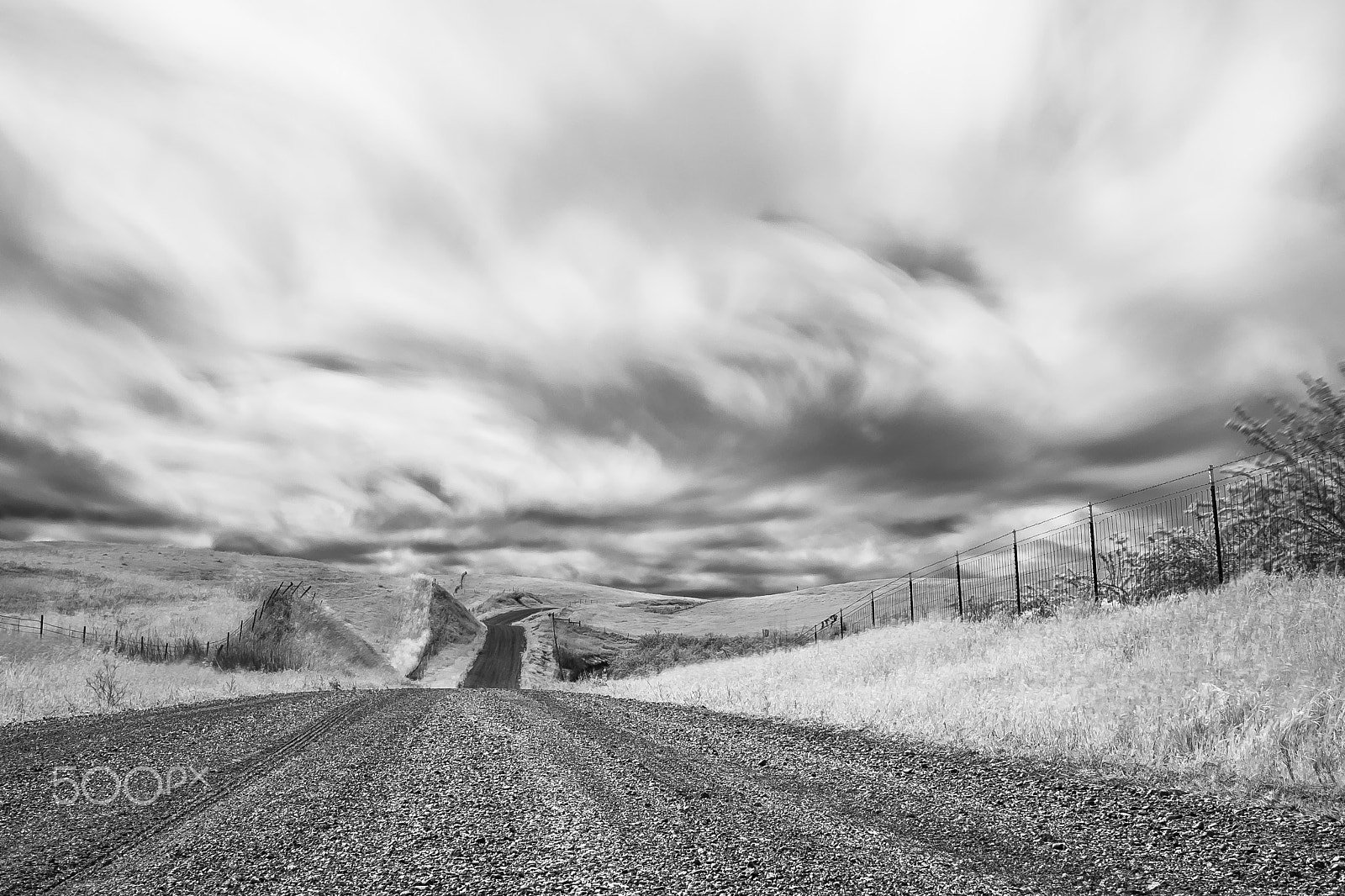 Sony a99 II sample photo. Follow the stormy dirt road photography