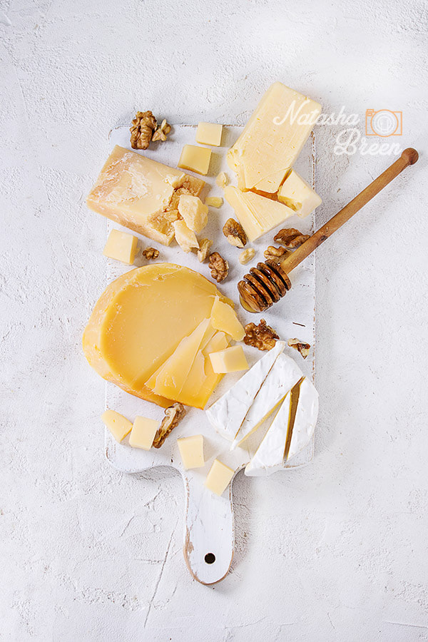 Canon EOS 700D (EOS Rebel T5i / EOS Kiss X7i) sample photo. Assortment of cheese on wooden board photography
