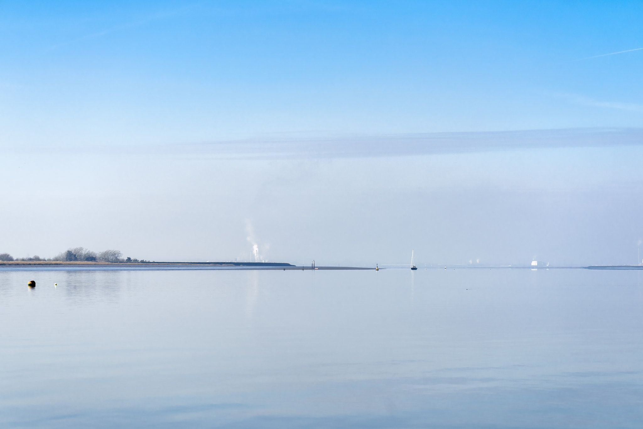 Sony FE 70-300mm F4.5-5.6 G OSS sample photo. View of the river swale from harty island kent on a tranquil win photography