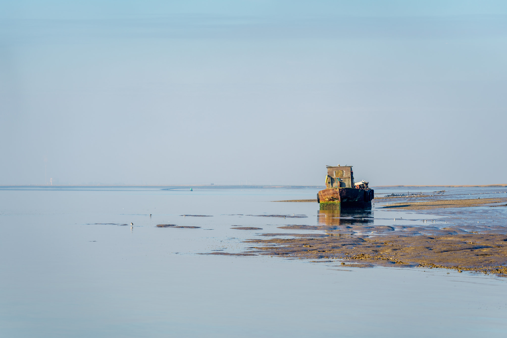 Sony a7 II + Sony FE 70-300mm F4.5-5.6 G OSS sample photo. View of an old boat on the river swale photography