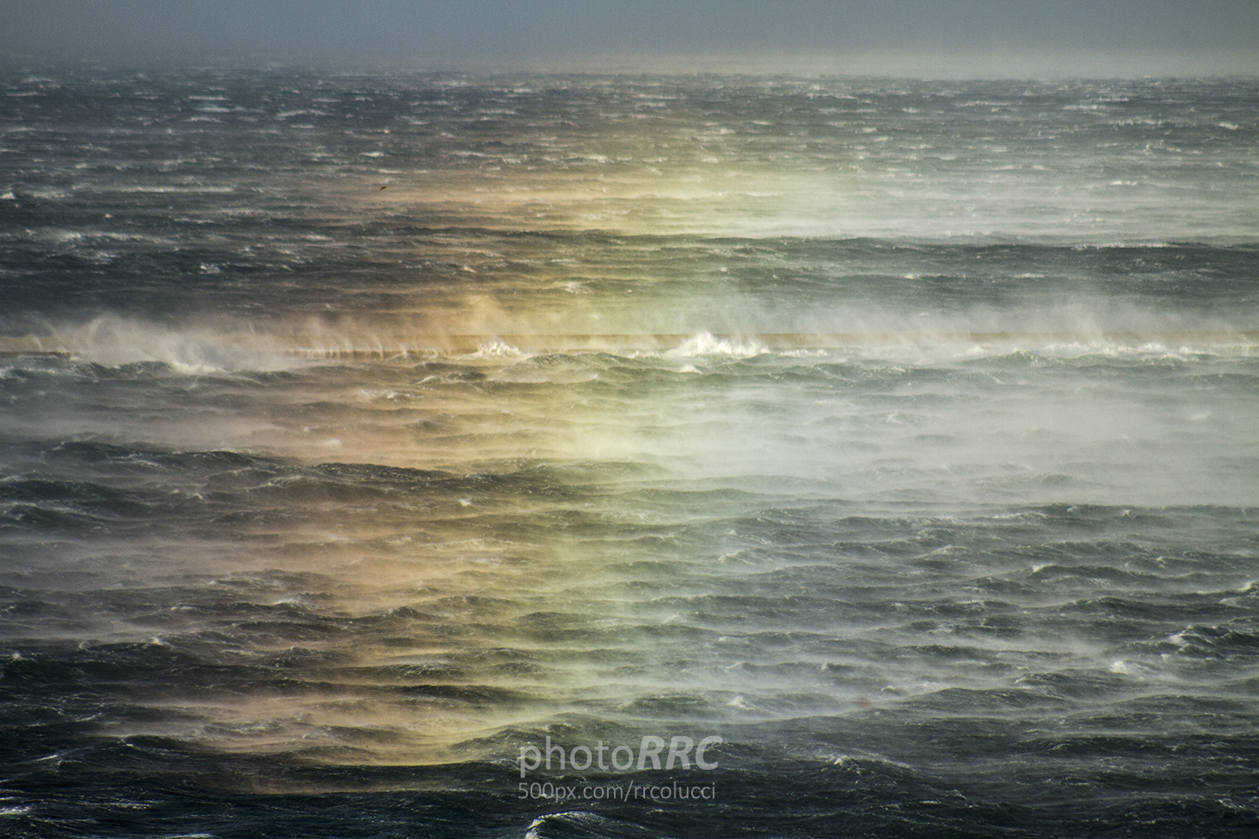 Canon EOS 7D + EF75-300mm f/4-5.6 sample photo. Sea-spray rainbow photography