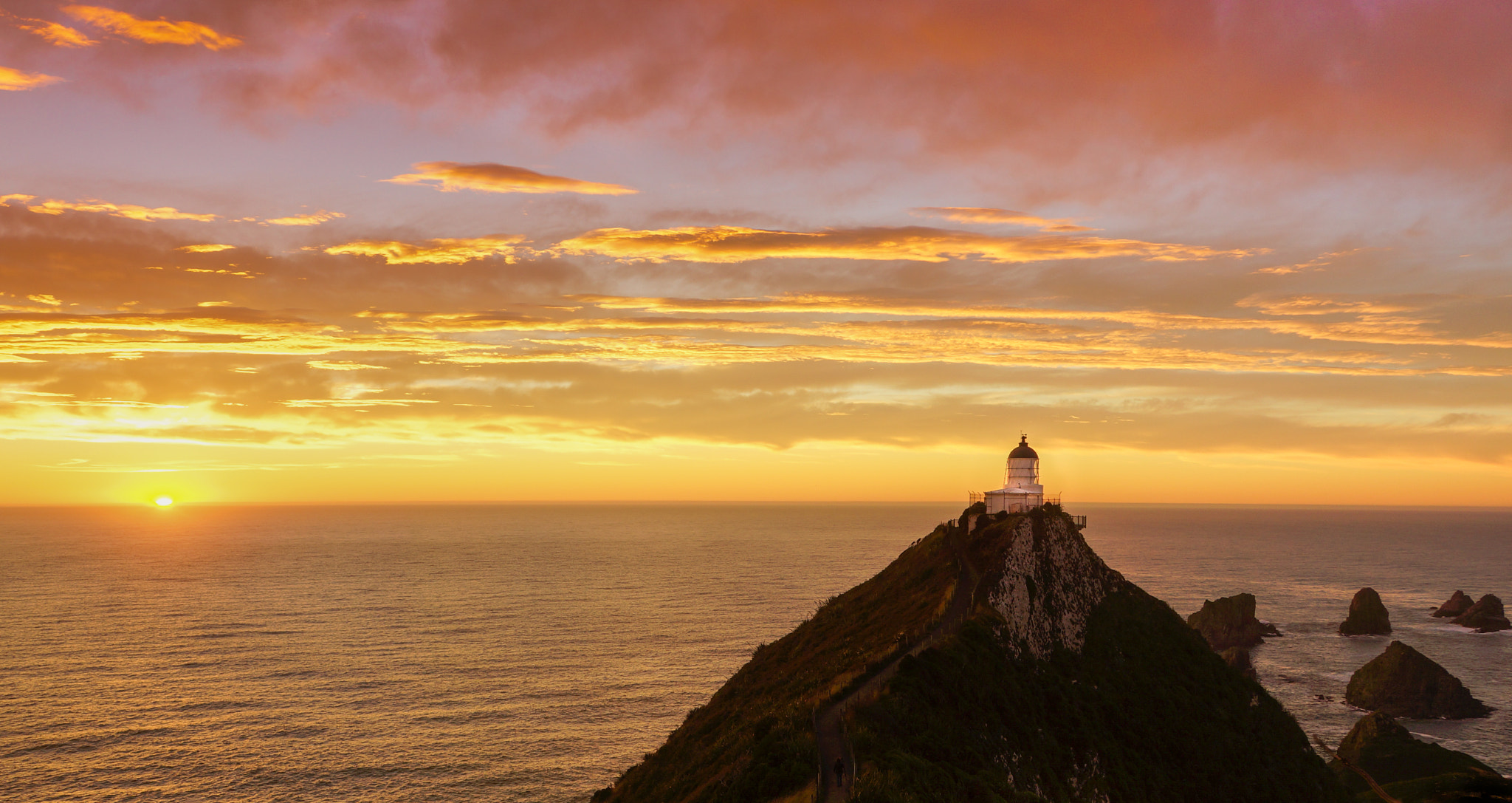Sony E 18-200mm F3.5-6.3 OSS sample photo. Sunrise at nuggets point photography