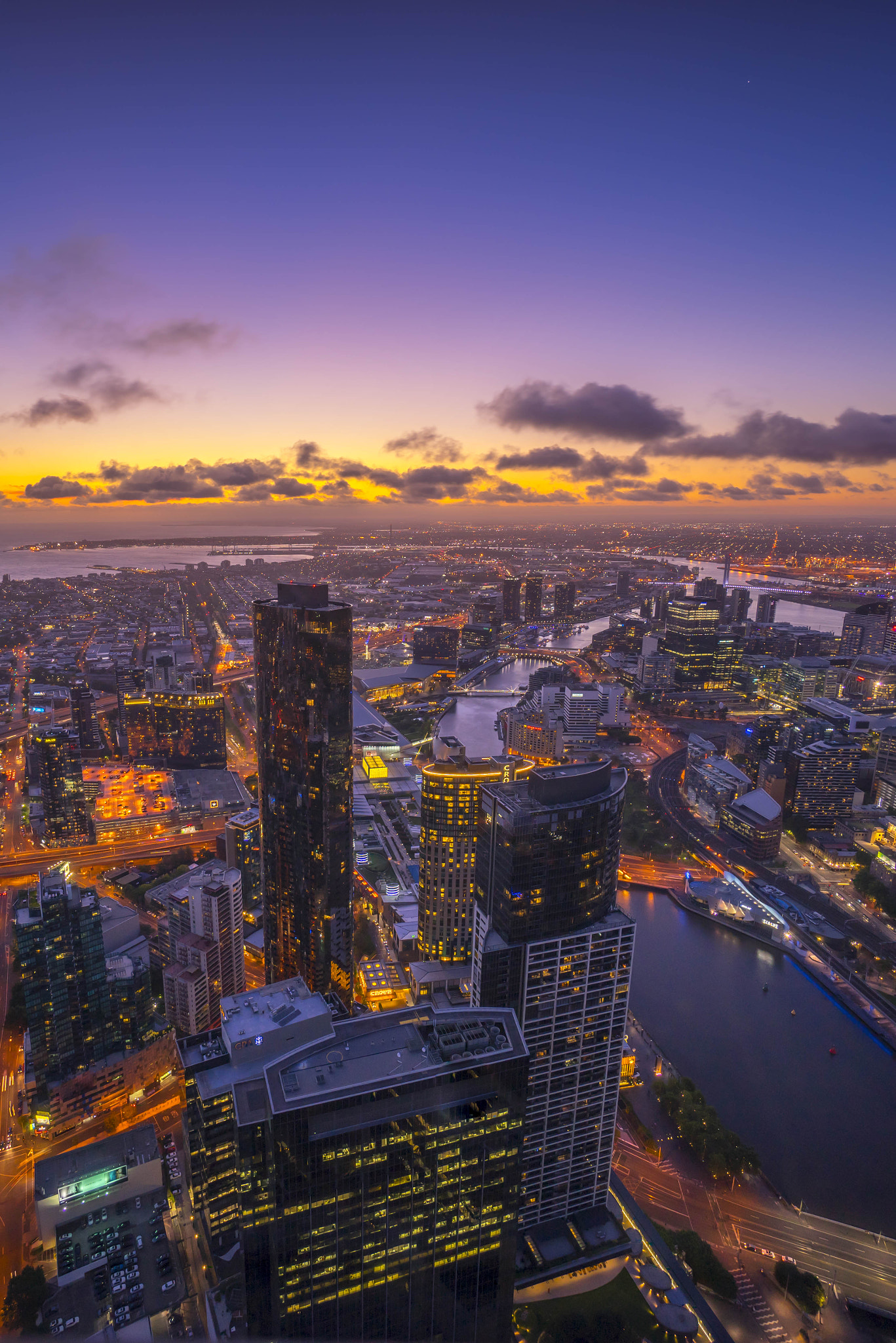 Sony a7R + Sony E 10-18mm F4 OSS sample photo. Aerial view of dramatic sunset at melbourne city skyline photography