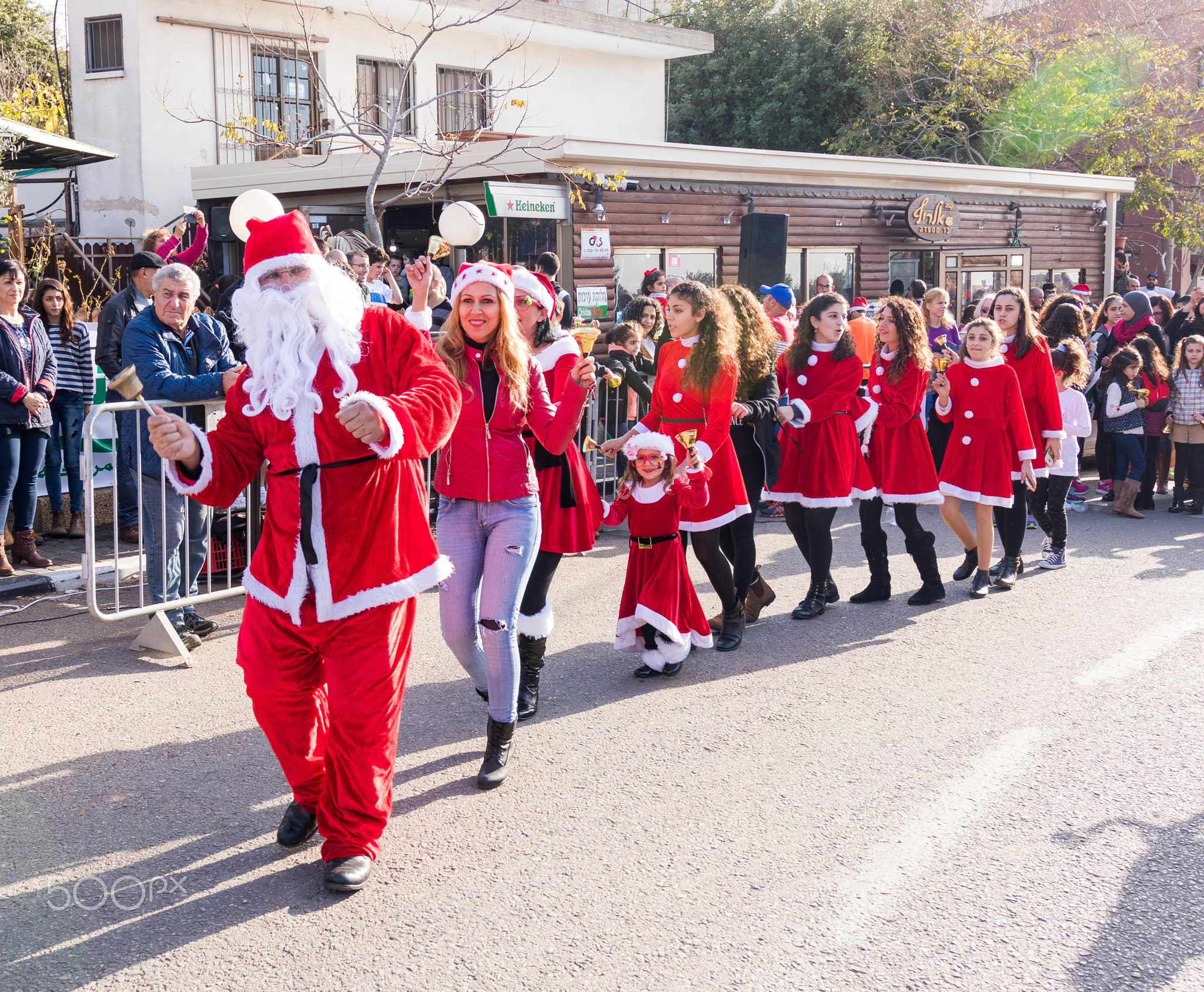 Group of Santa Clauses entertains participants of annual Christ