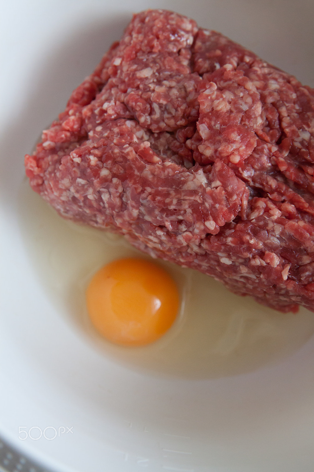 Canon EOS 50D + Canon EF 24-70mm F2.8L II USM sample photo. Ground meat with raw egg still life photography