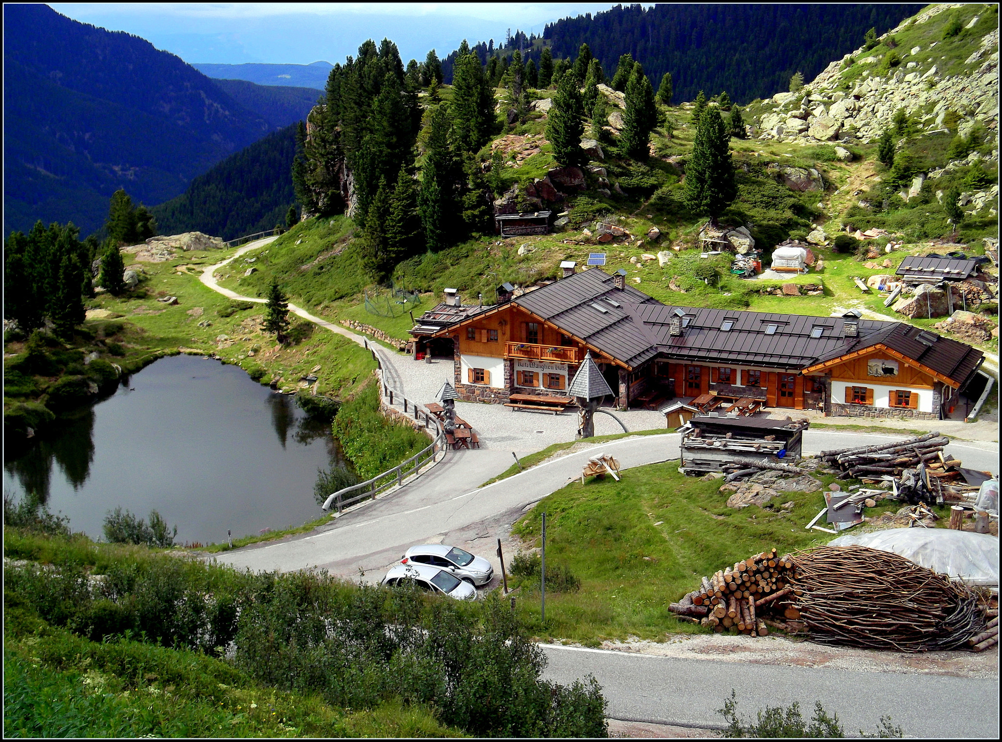 Fujifilm FinePix JX250 sample photo. Rifugio manghen e laghetto di cadinello, visto da passo manghen a mt. 2042. photography