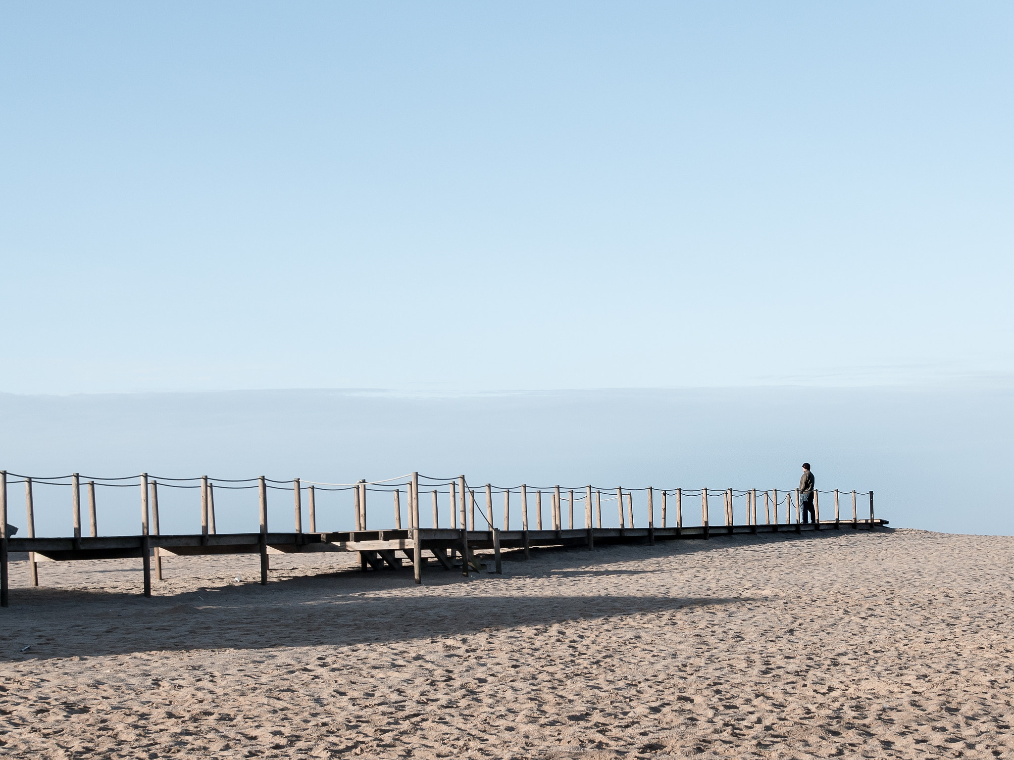 .7x Metabones 18-35/1.8 sample photo. A man on the beach pier photography