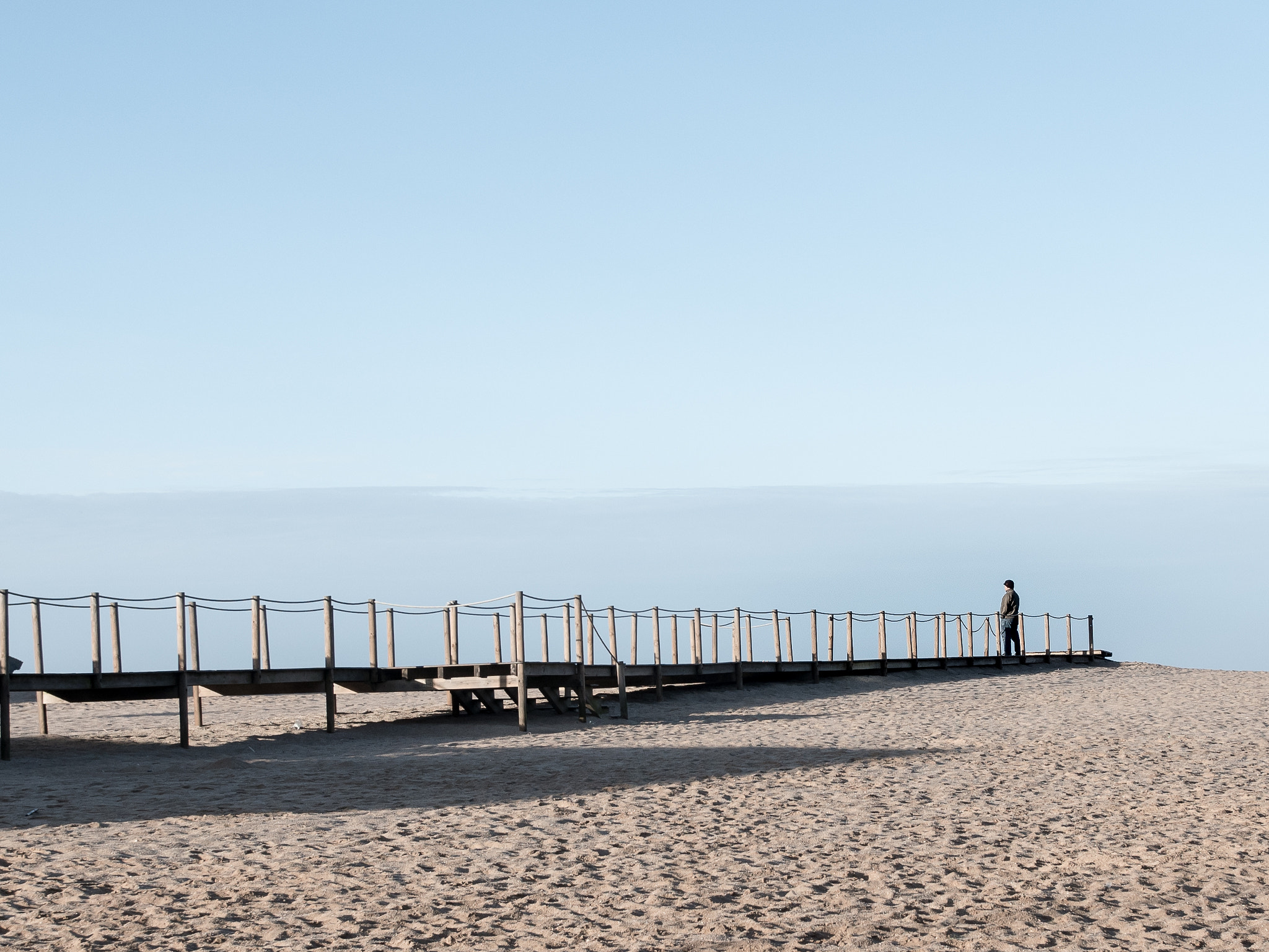 Panasonic Lumix DMC-GH4 sample photo. A man on the beach pier photography