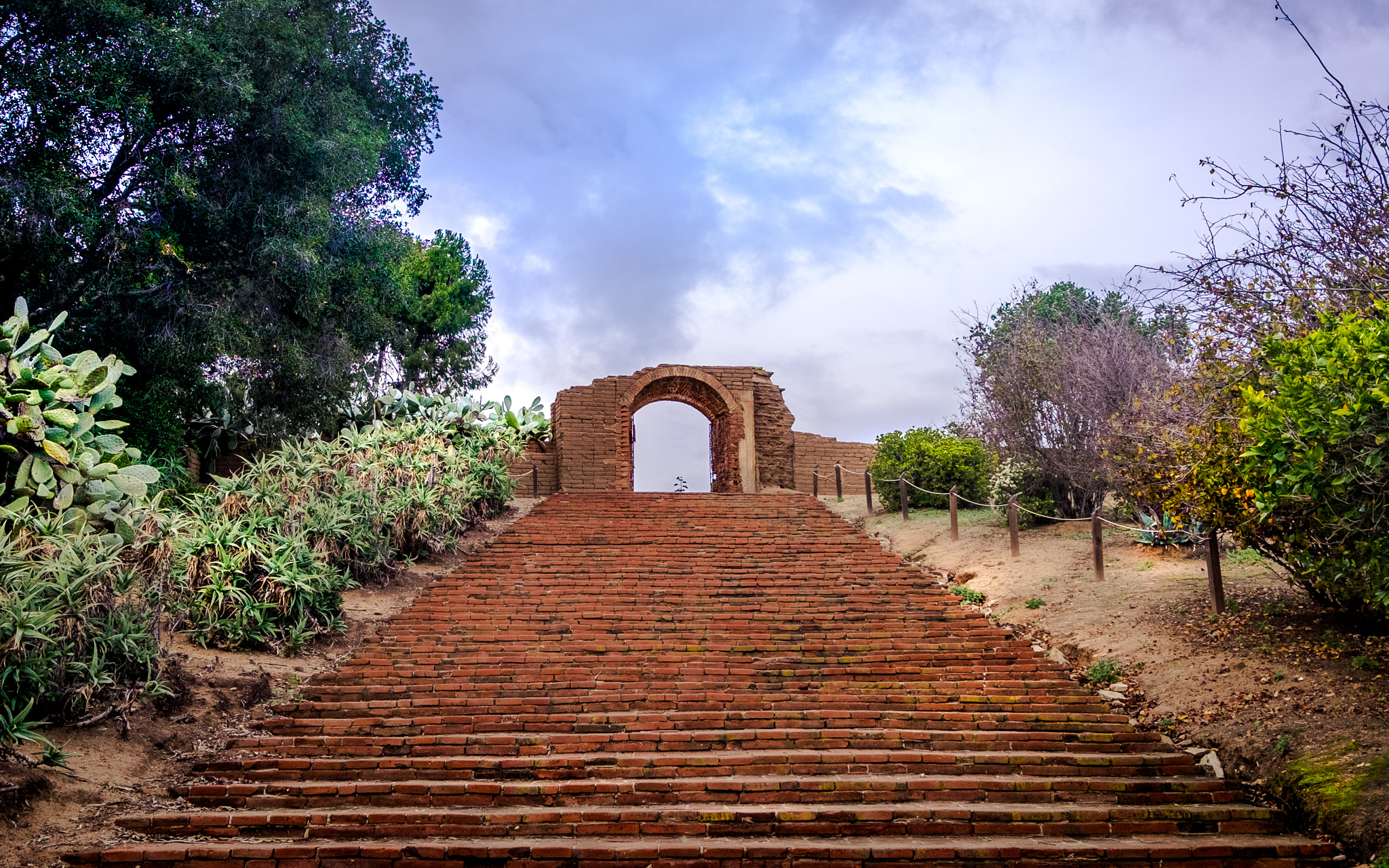 Fujifilm X-T10 sample photo. Stairs and archway photography