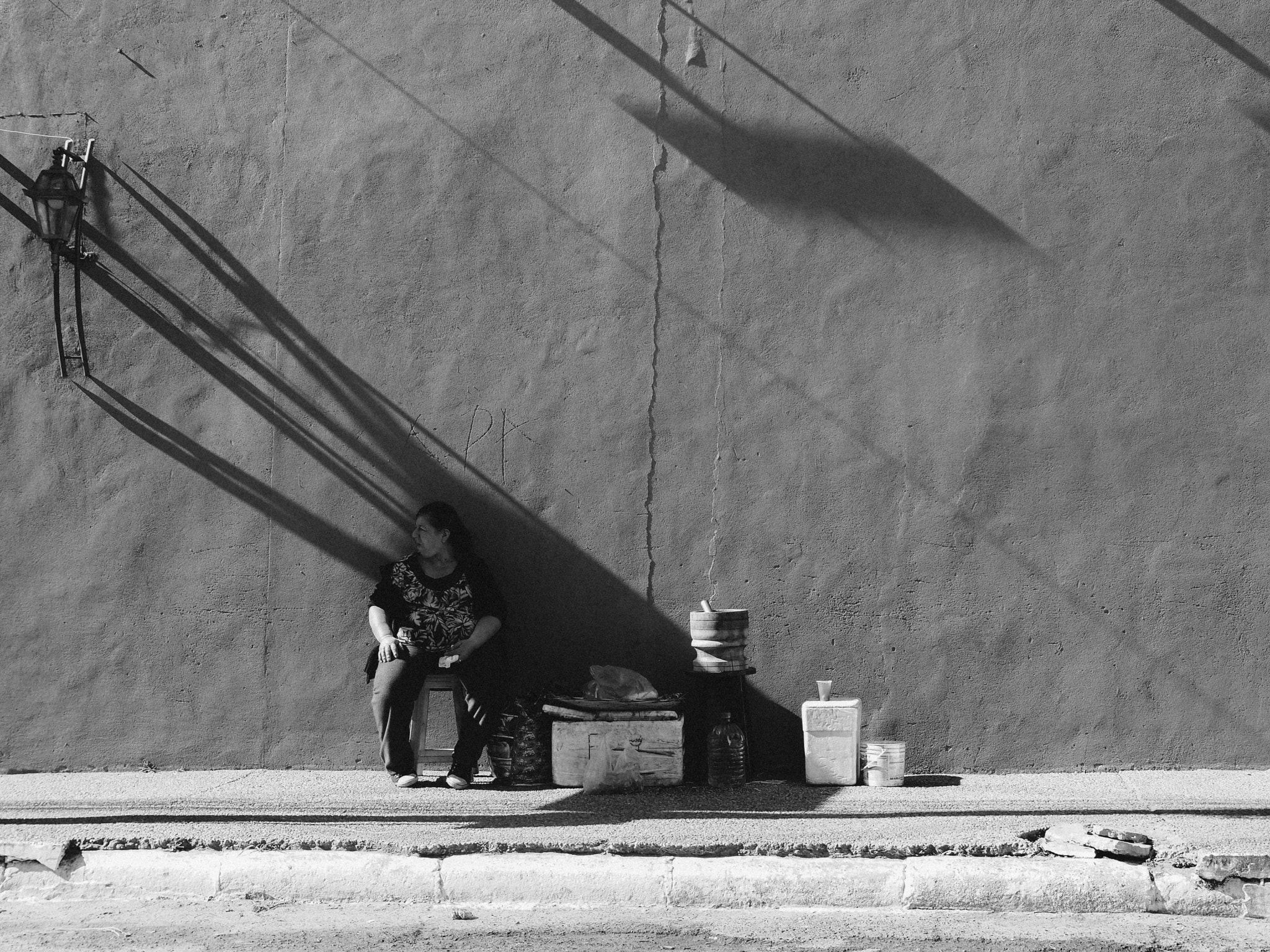 Olympus PEN E-PL3 + Panasonic Leica DG Summilux 25mm F1.4 II ASPH sample photo. Tereré cold tea vendor under shadow photography