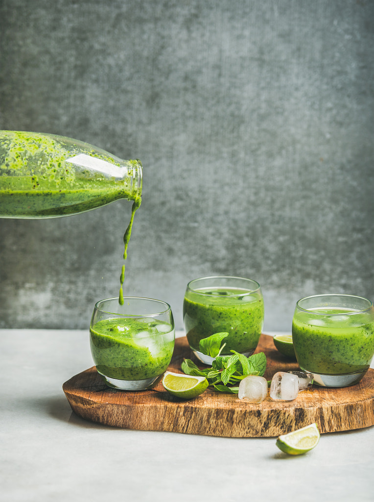 Fresh smoothie with ice, mint and lime pouring from bottle by Anna Ivanova on 500px.com