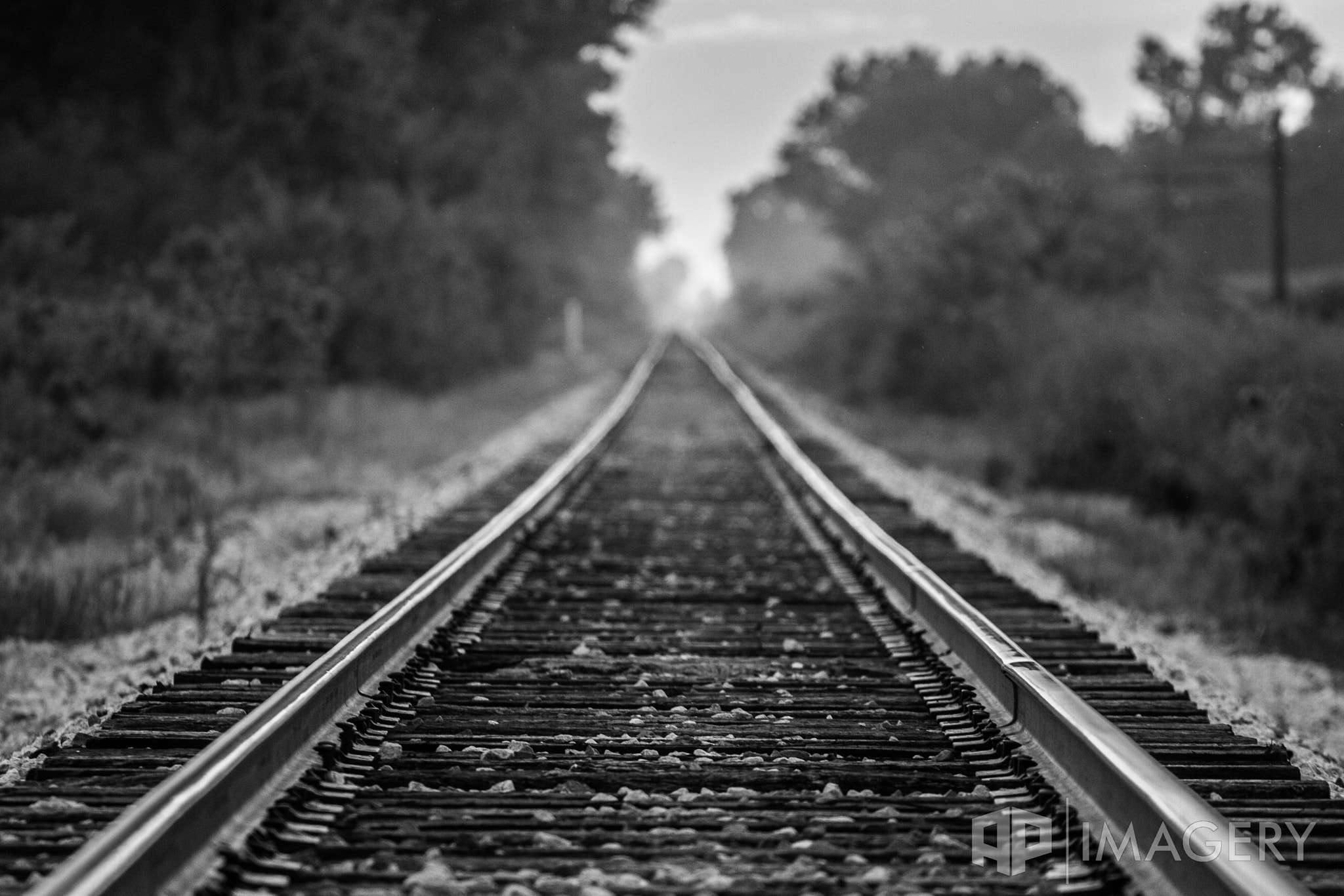 Canon EOS 40D + Canon EF 70-200mm F4L USM sample photo. B&w train tracks photography