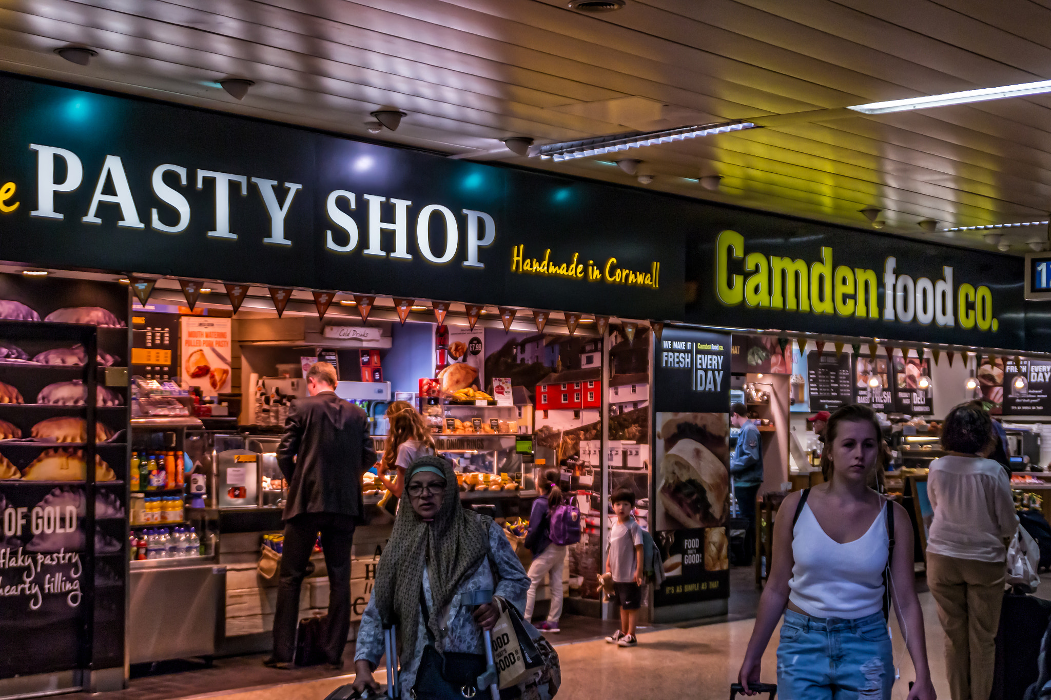 Canon EOS 70D sample photo. Train station shops photography