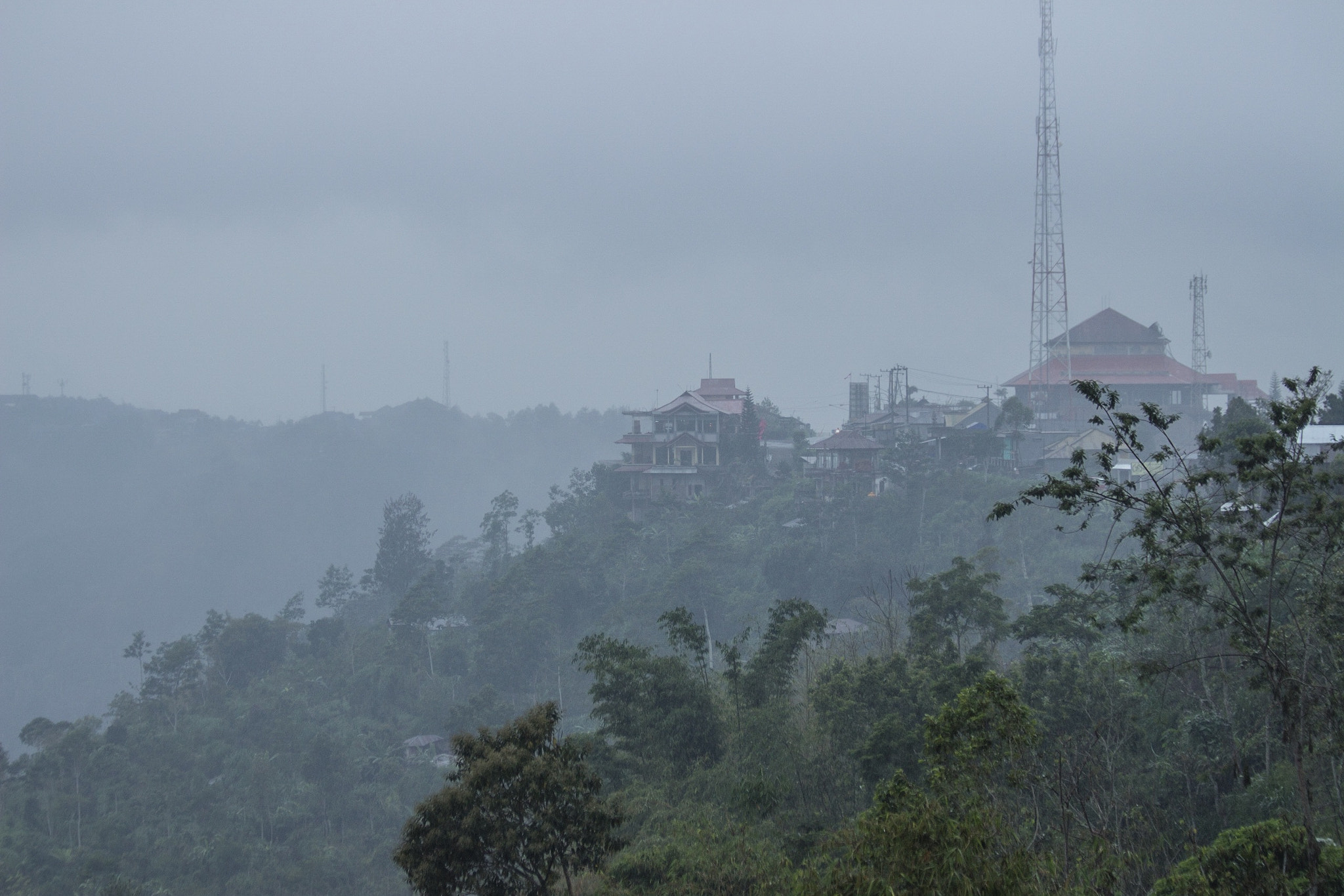 Canon EF 70-300mm F4-5.6 IS USM sample photo. Through the mist & rain in bali. photography