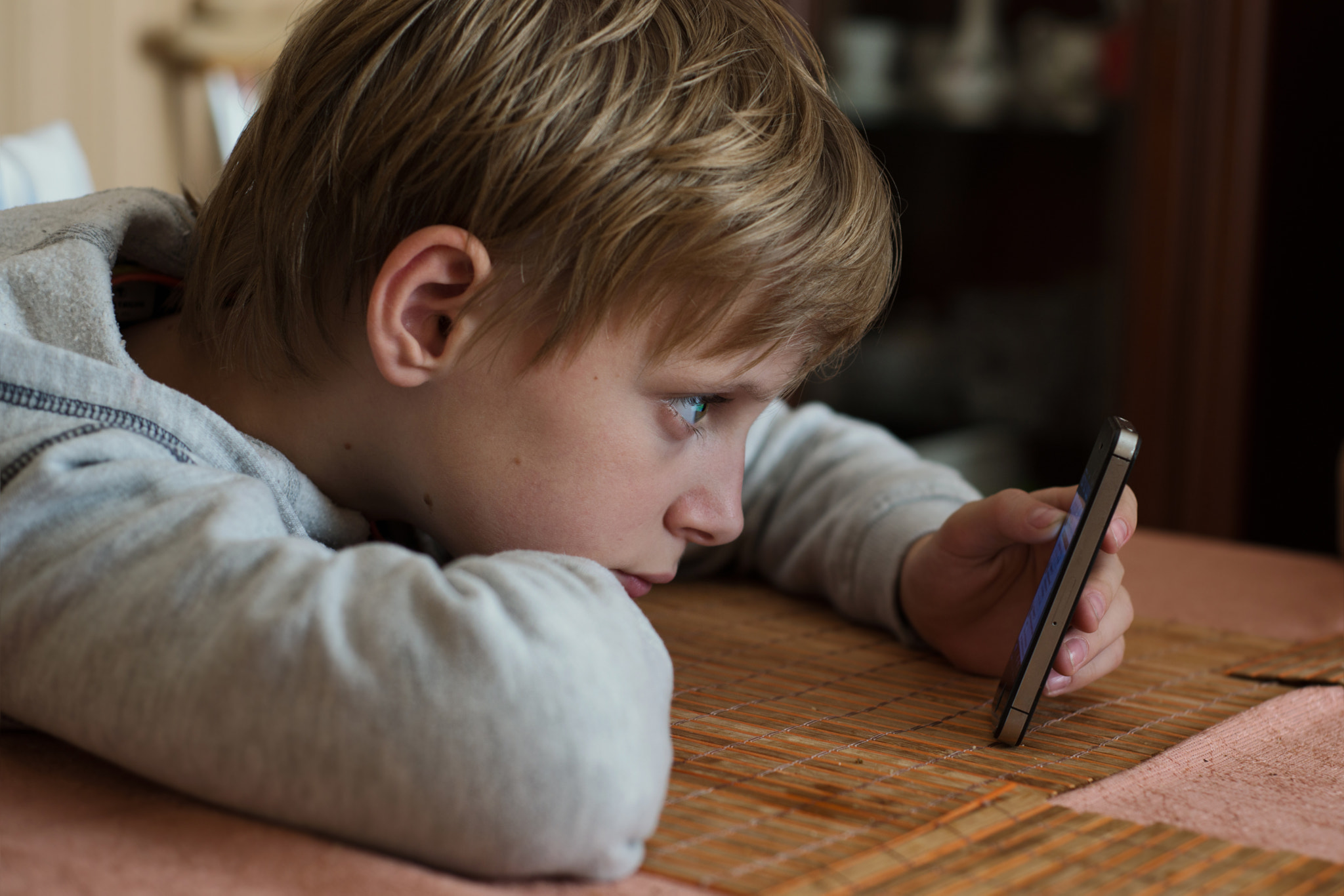 Boy looking at a smartphone