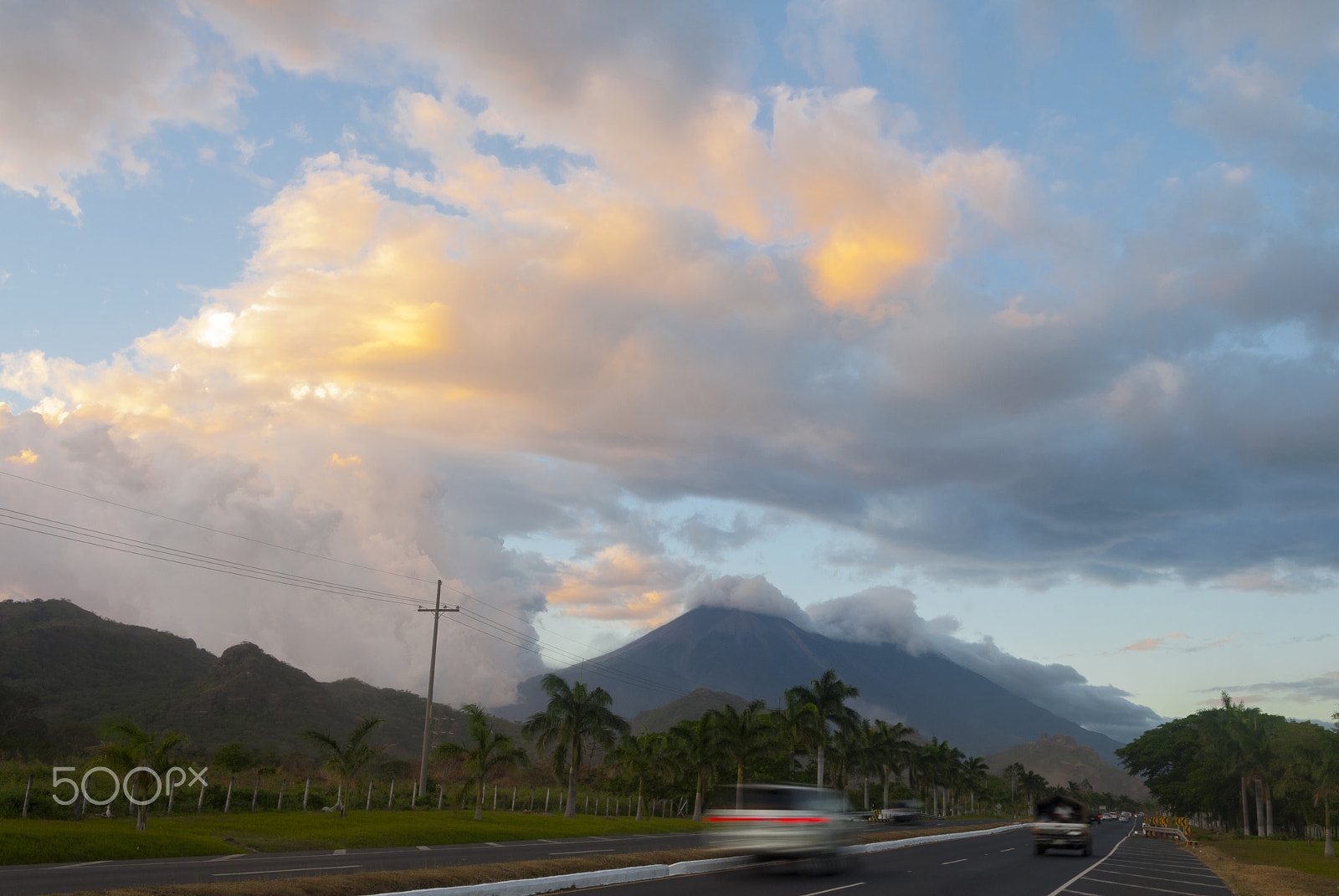 Nikon D200 sample photo. Sunset on highway with view of volcanoes. photography