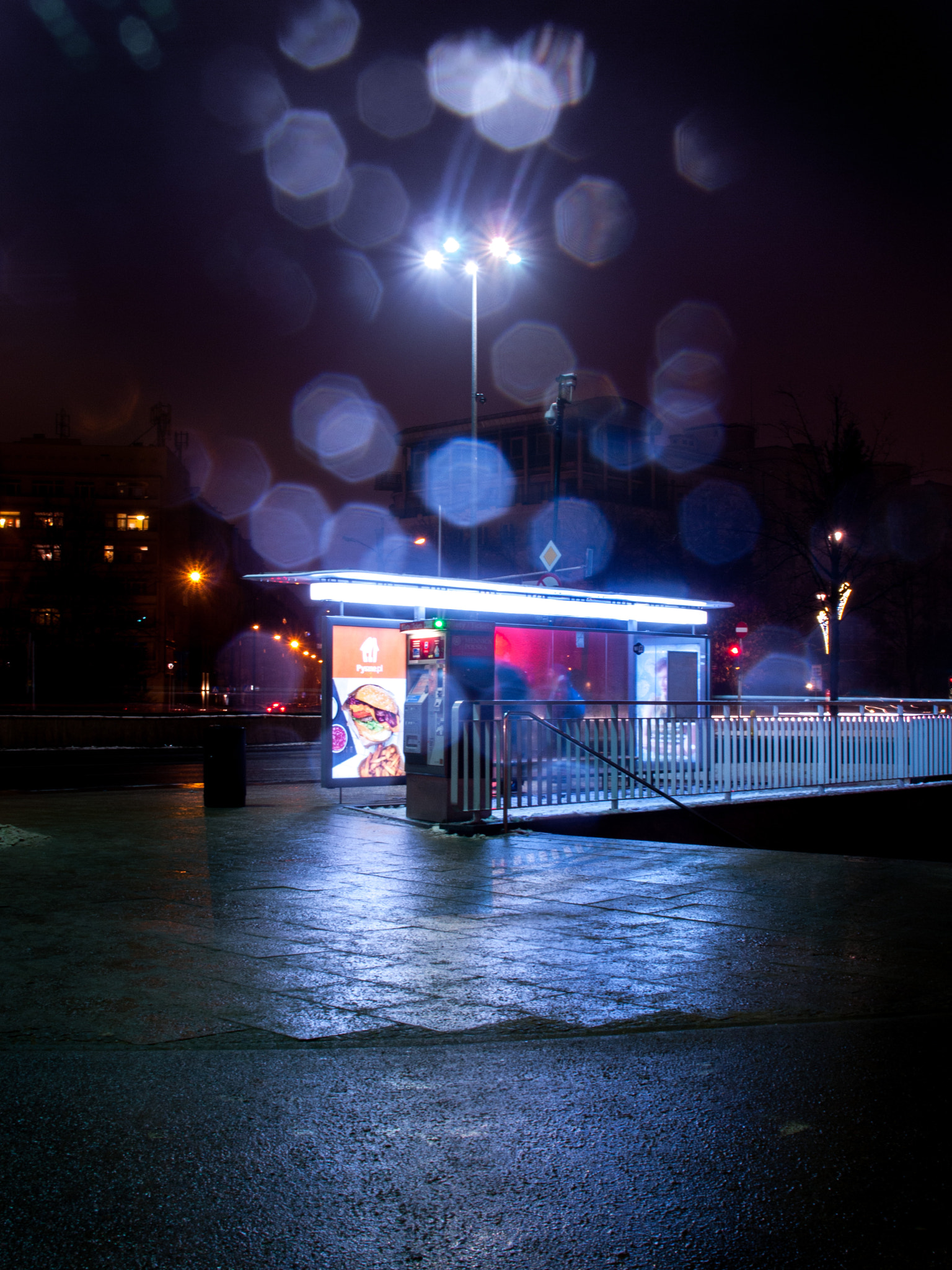 OLYMPUS 18mm-180mm Lens sample photo. Cinematic bus stop photography