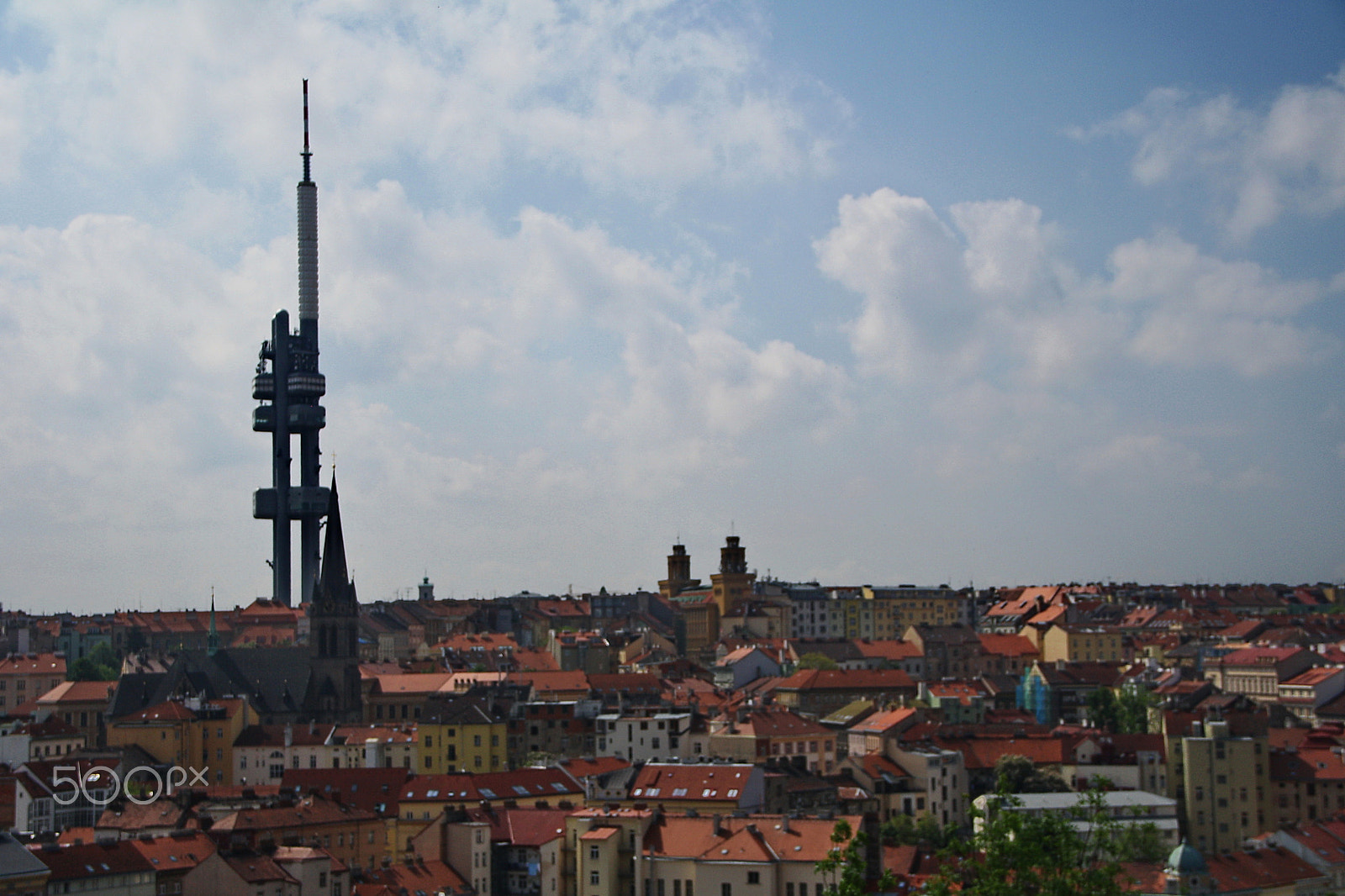 Canon EOS 1000D (EOS Digital Rebel XS / EOS Kiss F) sample photo. Towering over the rooftops of prague photography