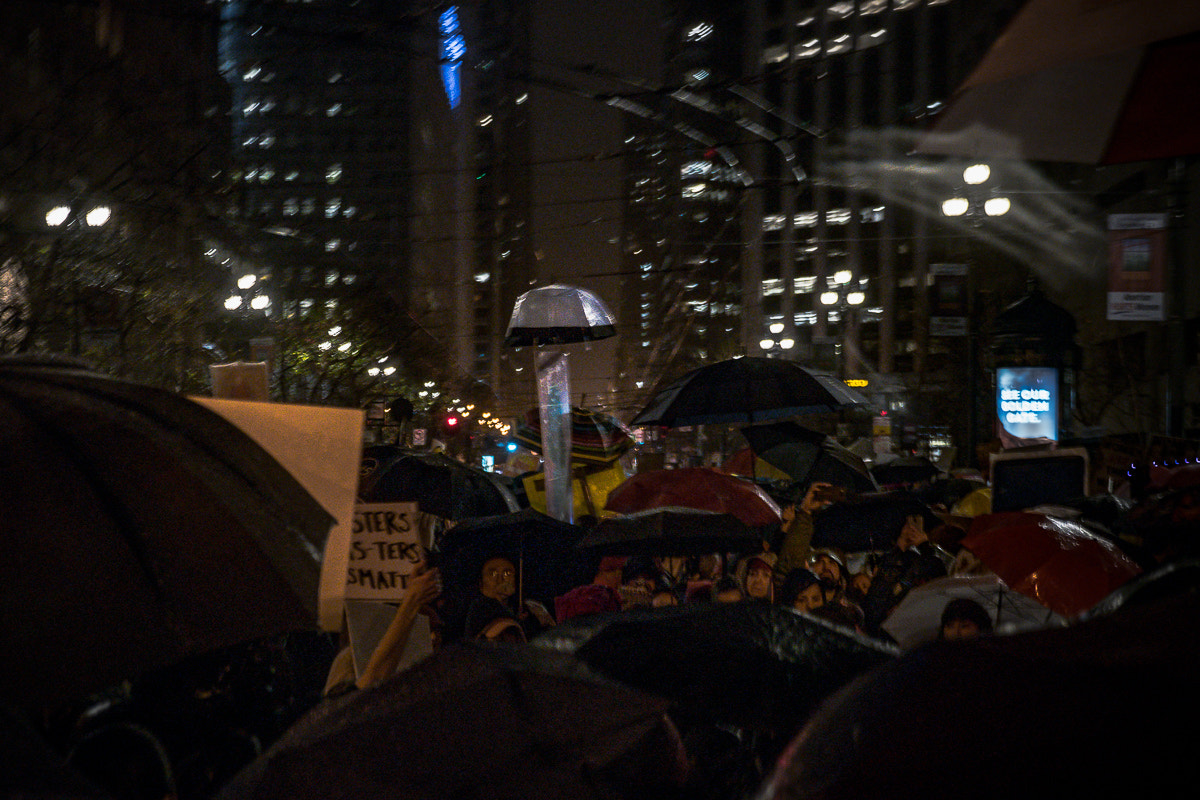 Panasonic Lumix DMC-GM5 + Panasonic Lumix G X Vario 12-35mm F2.8 ASPH Power OIS sample photo. Protesting trump in the rain photography