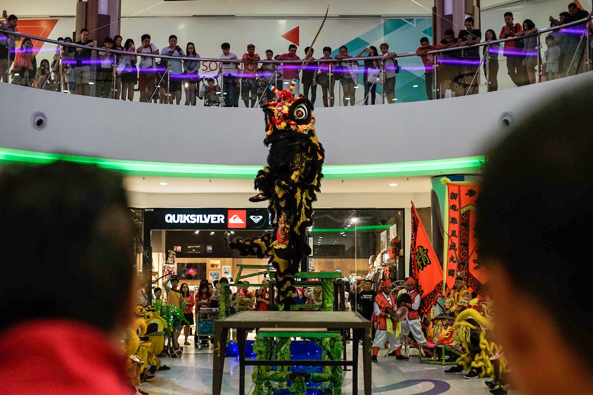 Sony a7 II sample photo. 22 january 2017, kuching, sarawak - lion dance troop performing at viva city, kuching. photography