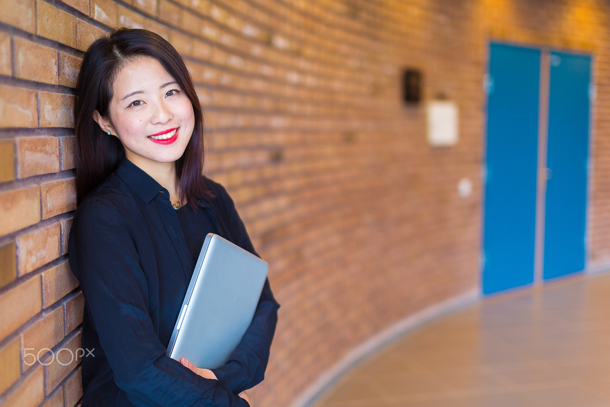 Beautiful Asian student on campus