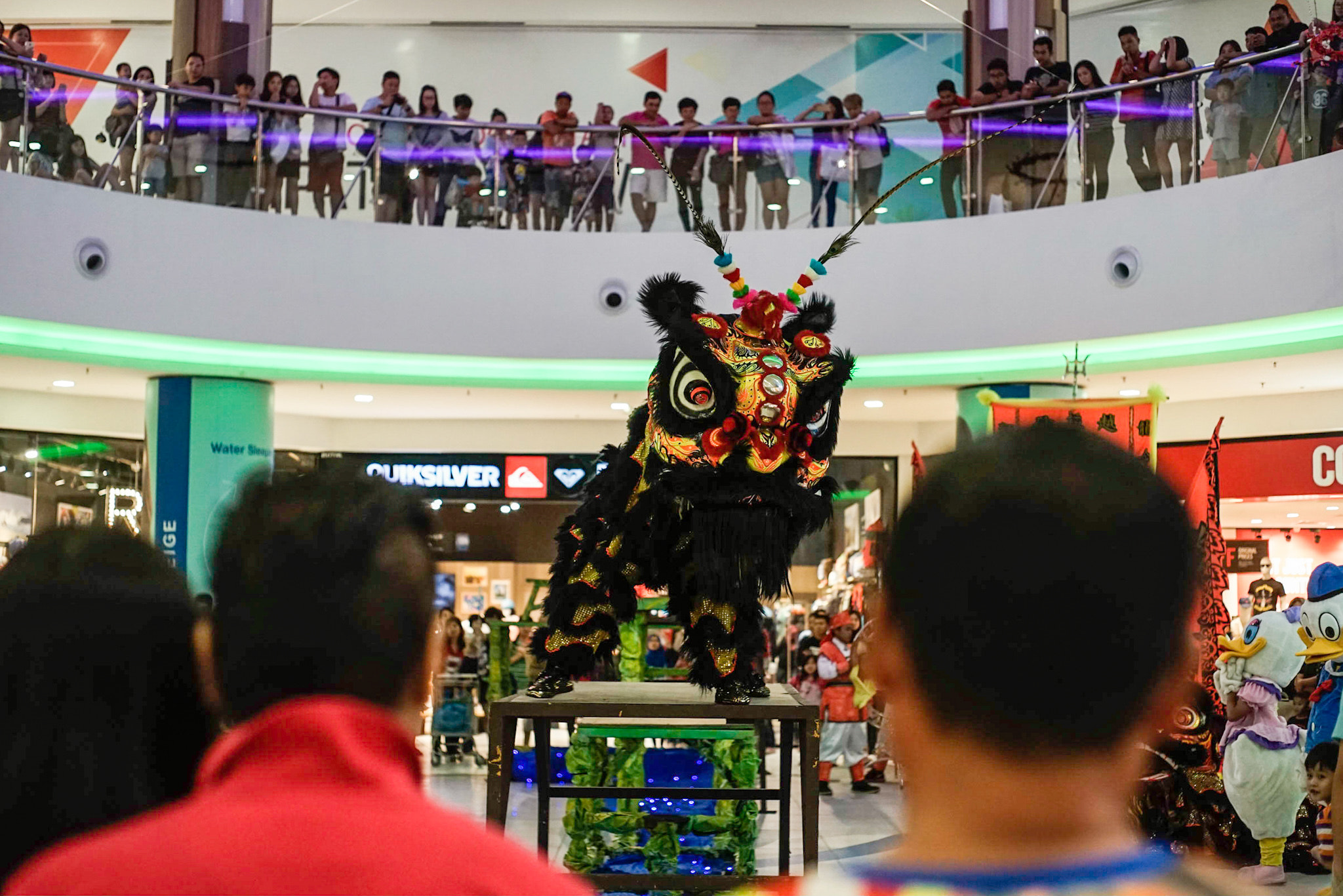 Sony a7 II + Minolta AF 50mm F1.7 sample photo. The lion dance troop showing an awesome move to the public in viva city mall kuching sarawak, 22... photography