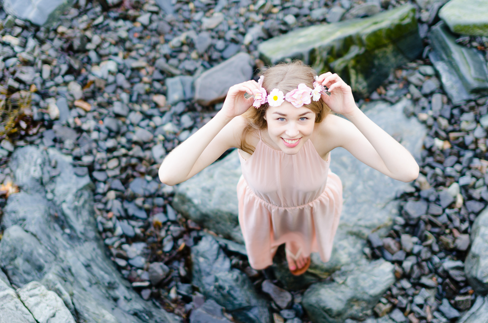 Nikon D7000 + Sigma 50mm F1.4 EX DG HSM sample photo. Female model in pink dress standing on rocks photography