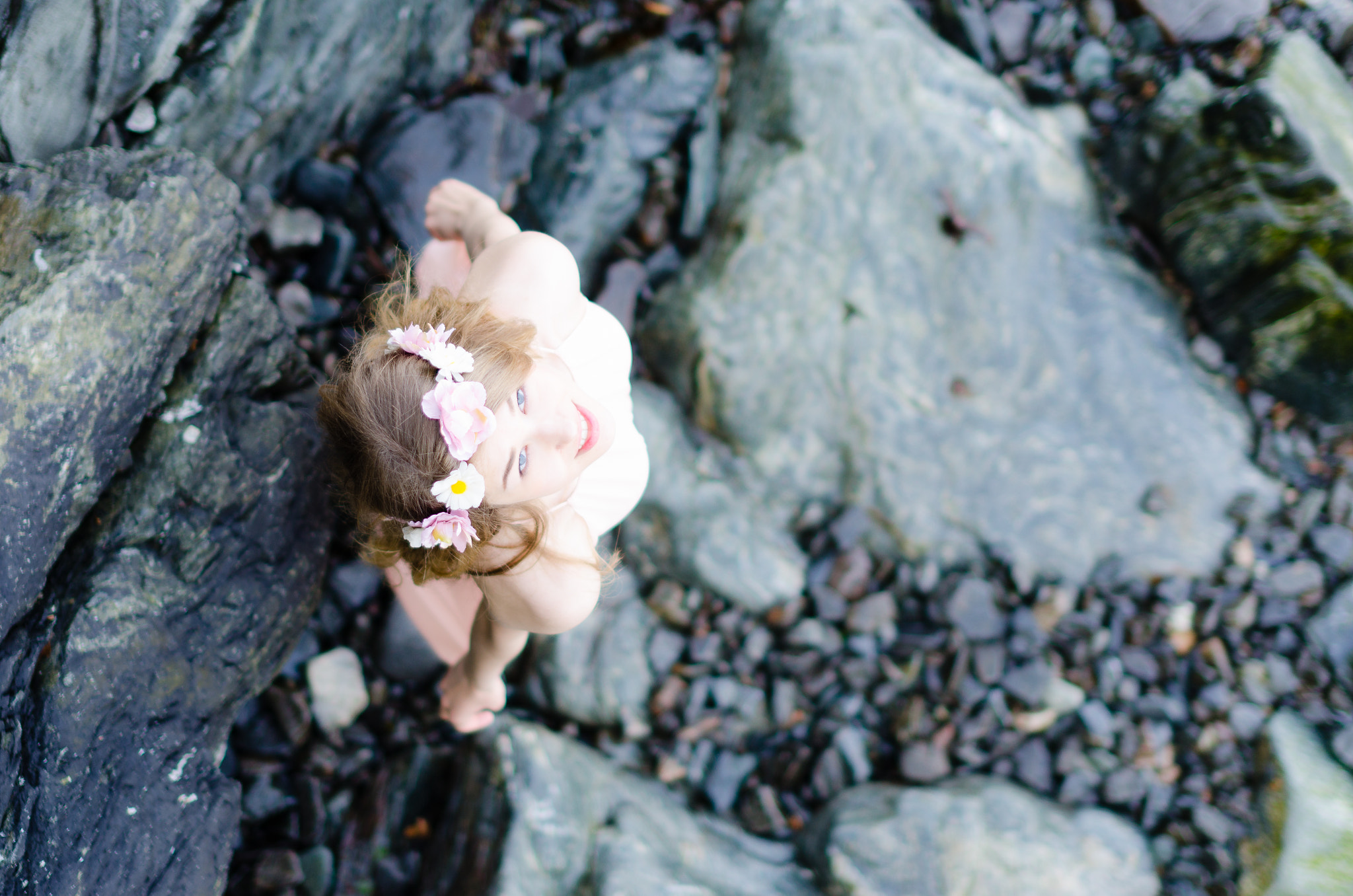 Nikon D7000 + Sigma 50mm F1.4 EX DG HSM sample photo. Female model in pink dress standing on rocks photography